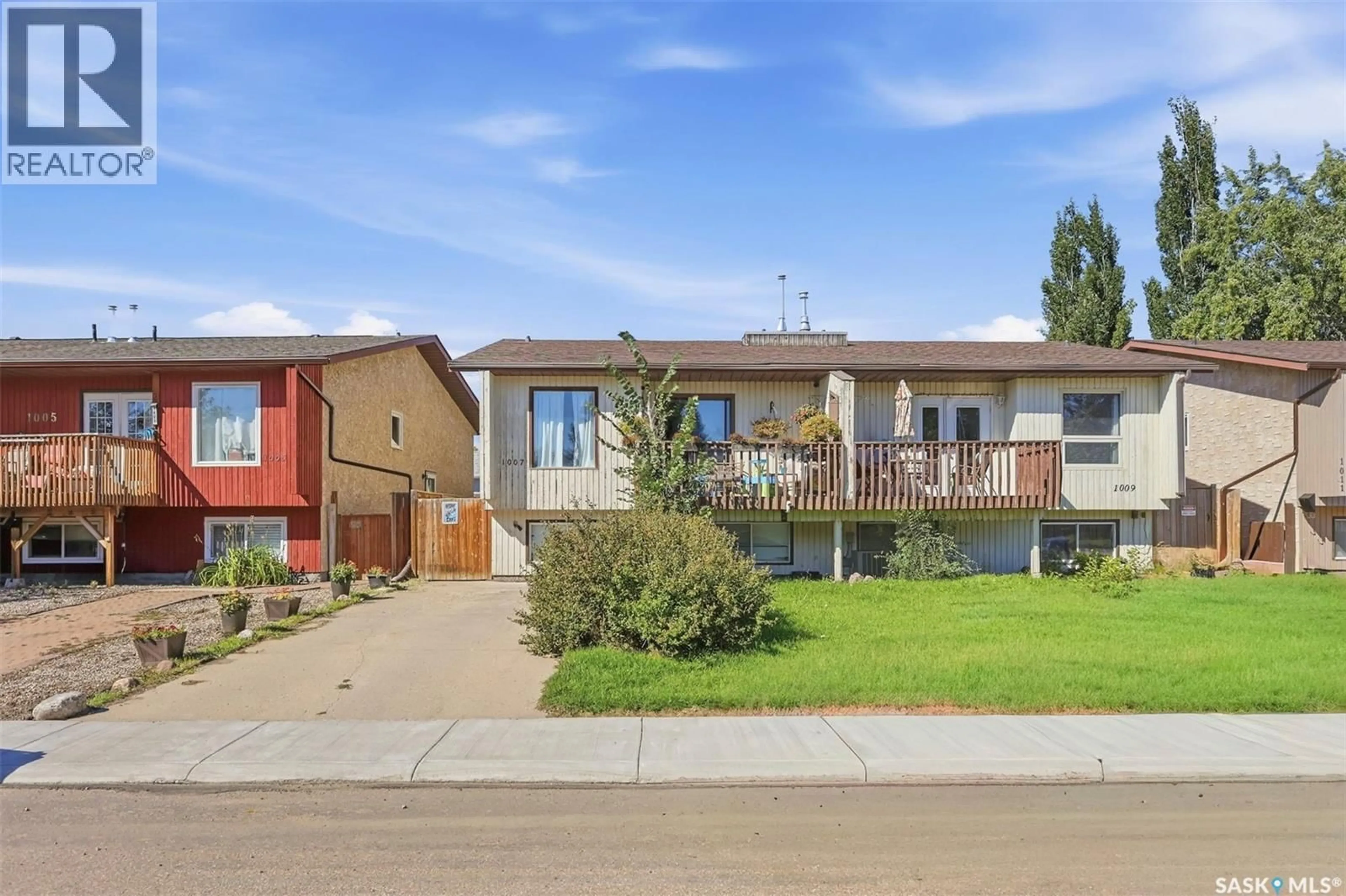 Home with brick exterior material, street for 1007-1009 MCCORMACK ROAD, Saskatoon Saskatchewan S7M5C2
