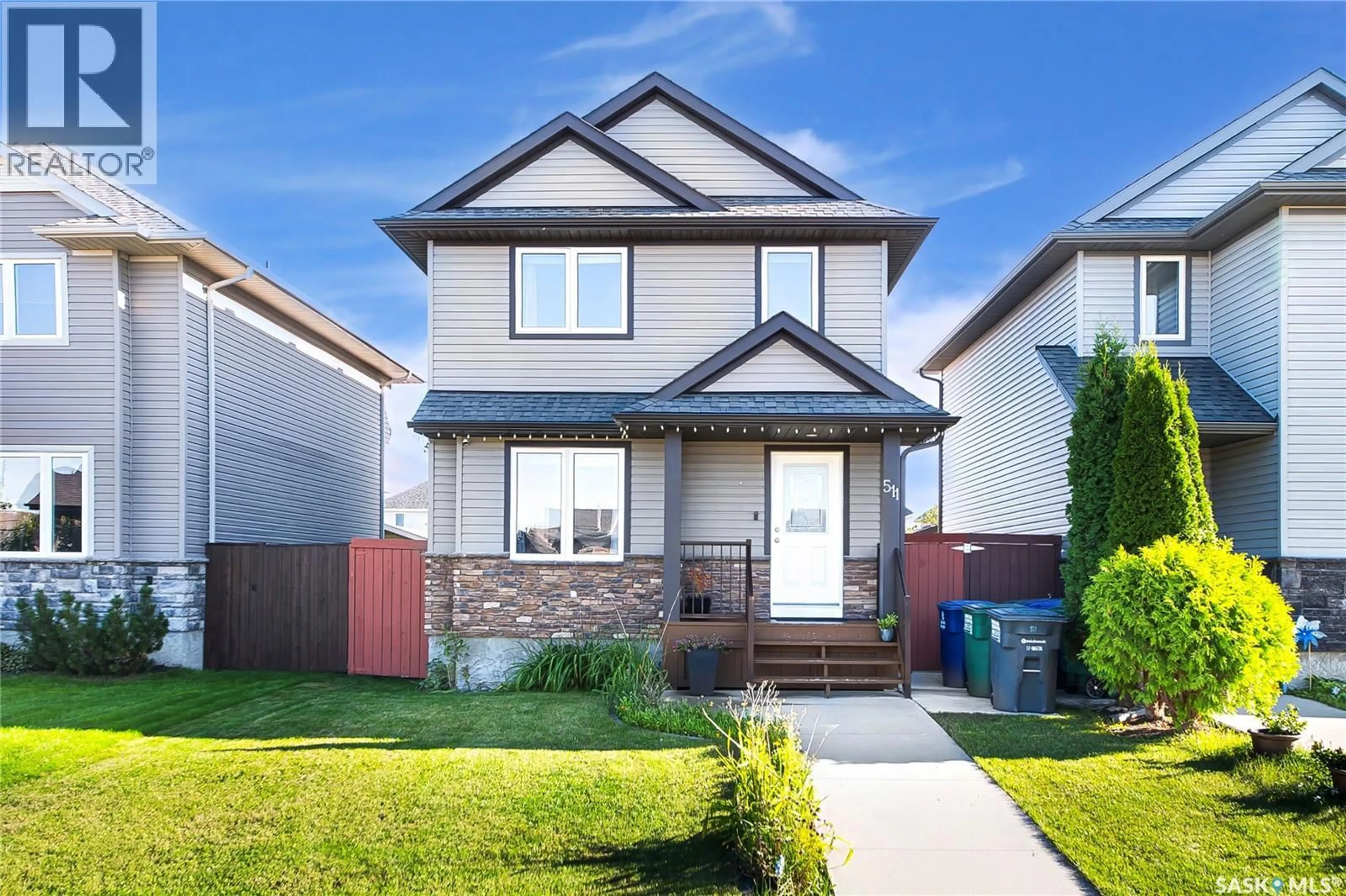Home with vinyl exterior material, street for 511 COAD CRESCENT, Saskatoon Saskatchewan S7R0A7