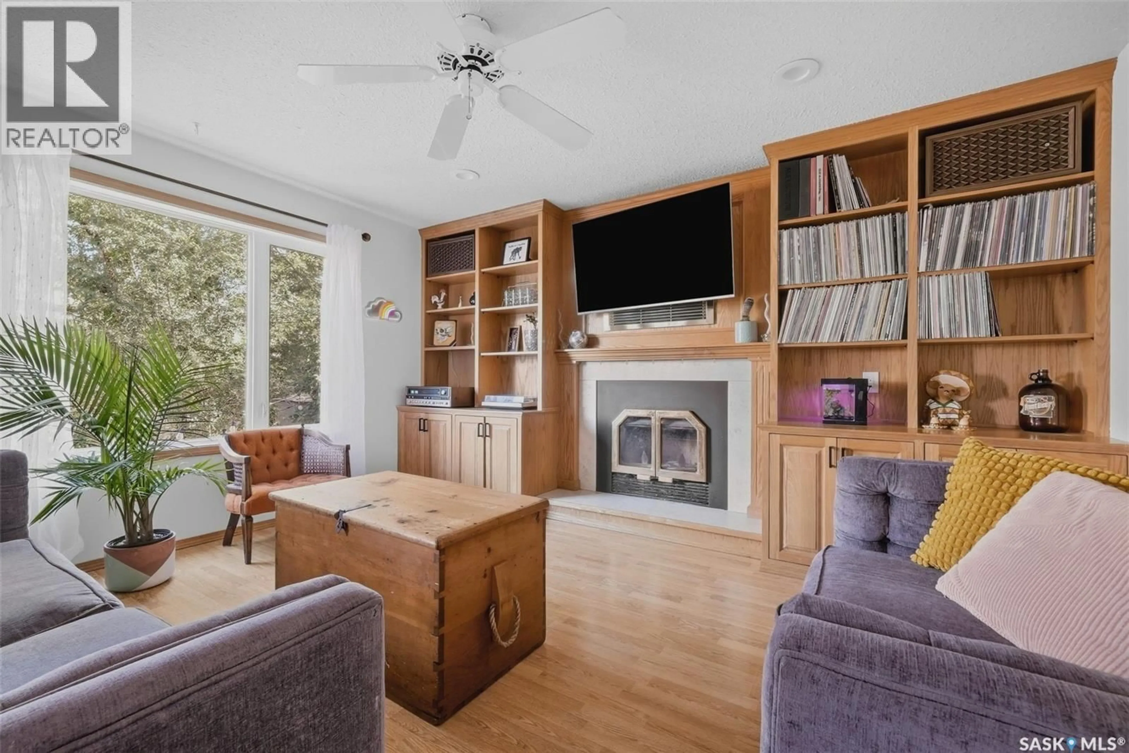 Living room with furniture, wood/laminate floor for 2641 GARNET STREET, Regina Saskatchewan S4T3A8