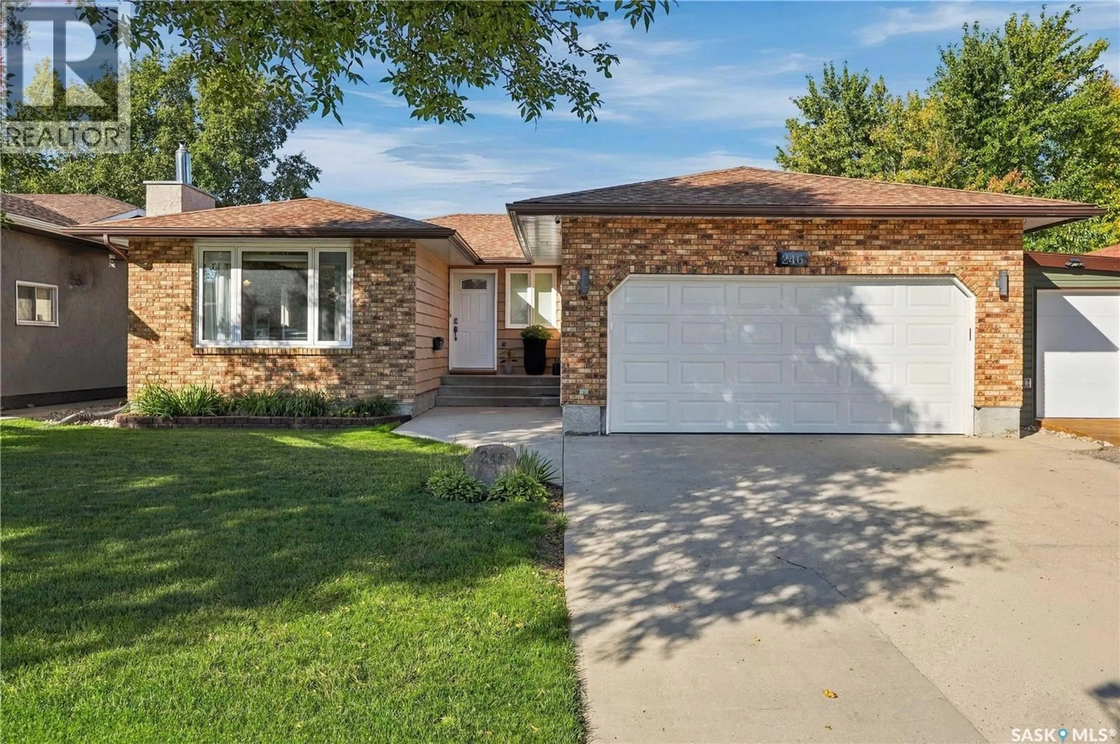 Home with brick exterior material, street for 246 HANSEN DRIVE, Regina Saskatchewan S4X2Y6