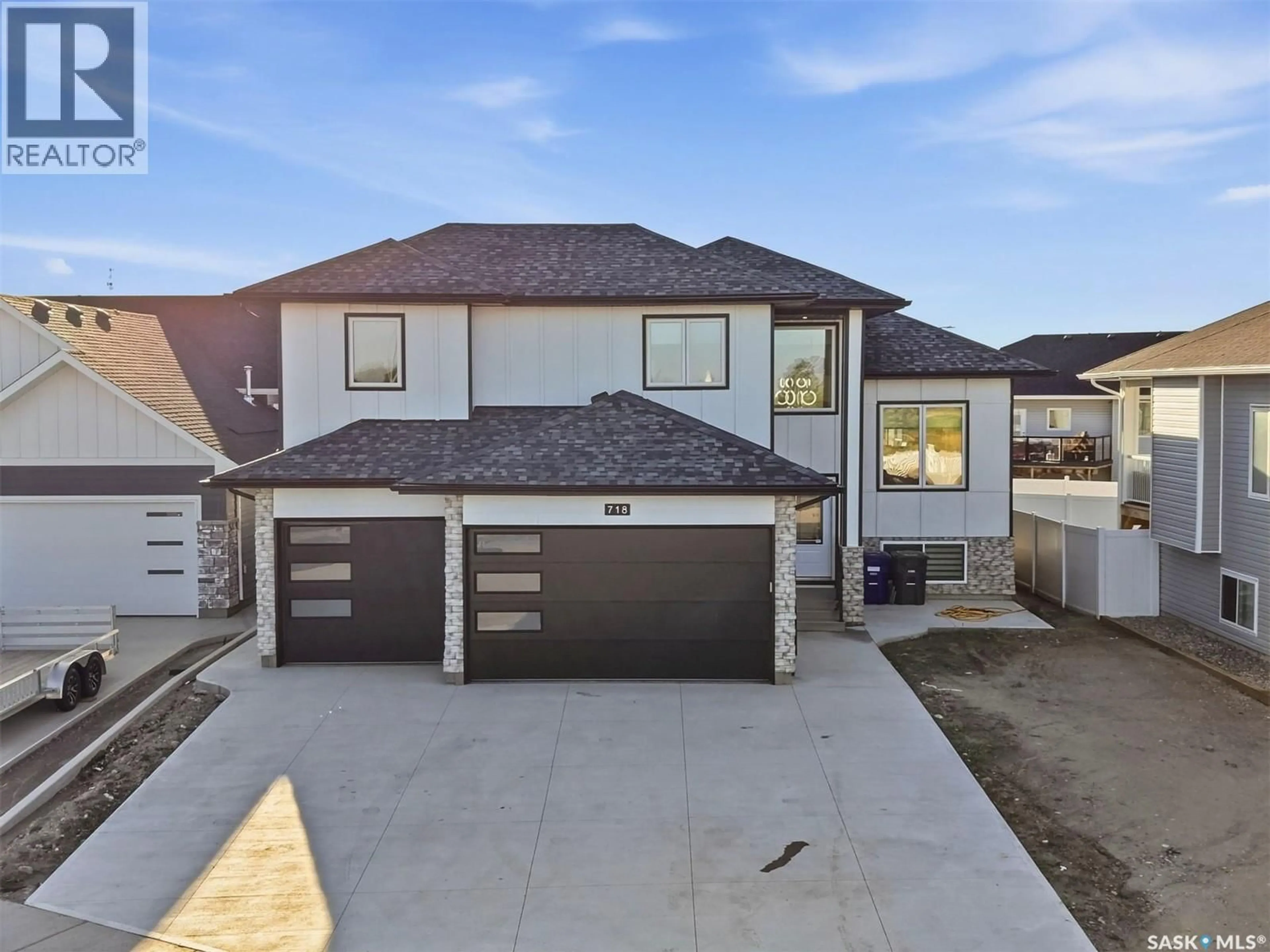 A pic from outside/outdoor area/front of a property/back of a property/a pic from drone, street for 718 WEIR CRESCENT, Warman Saskatchewan S0K4S4
