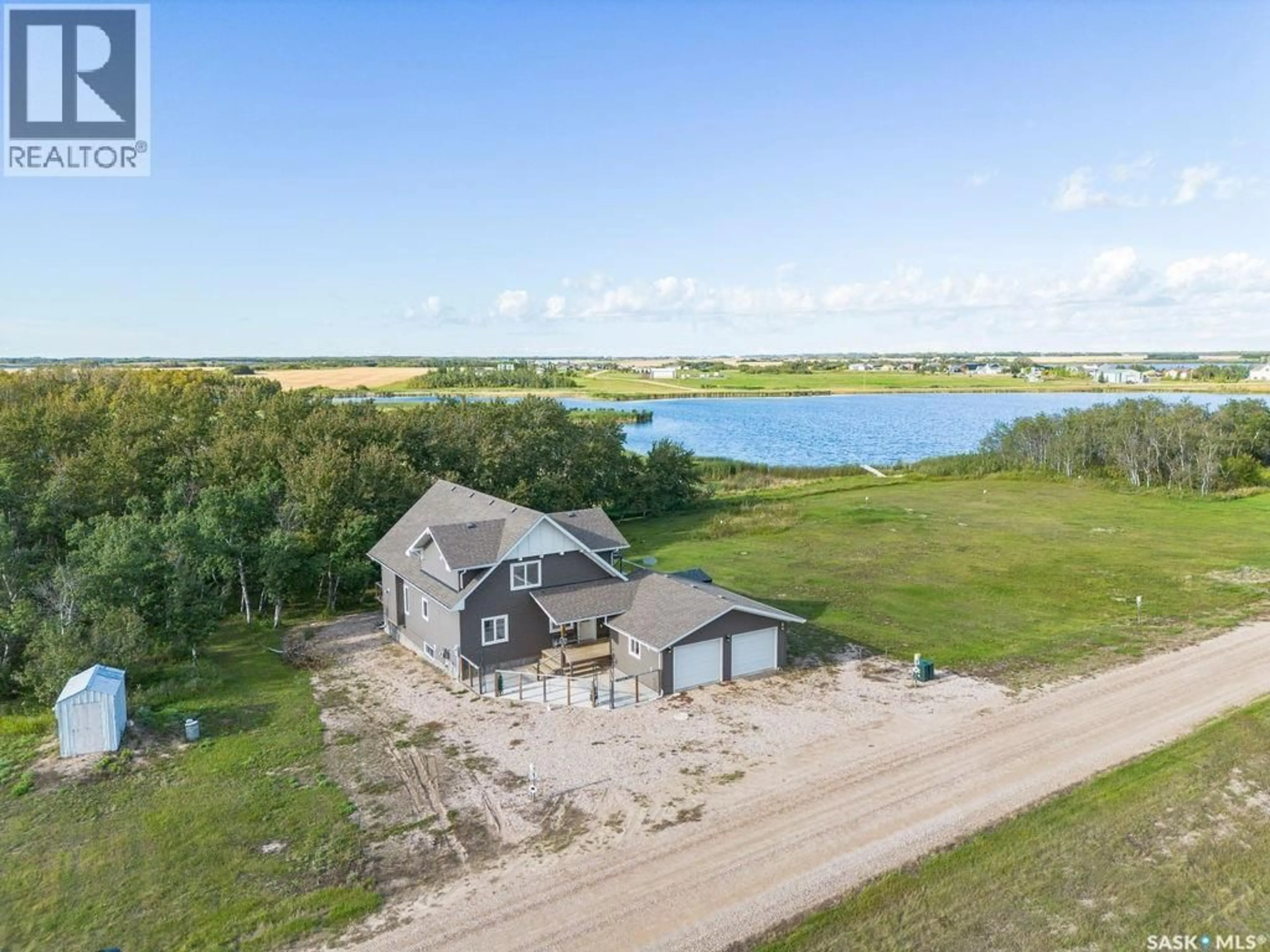 A pic from outside/outdoor area/front of a property/back of a property/a pic from drone, water/lake/river/ocean view for 1&2 PELICAN LANE, Humboldt Lake Saskatchewan S0K2A0