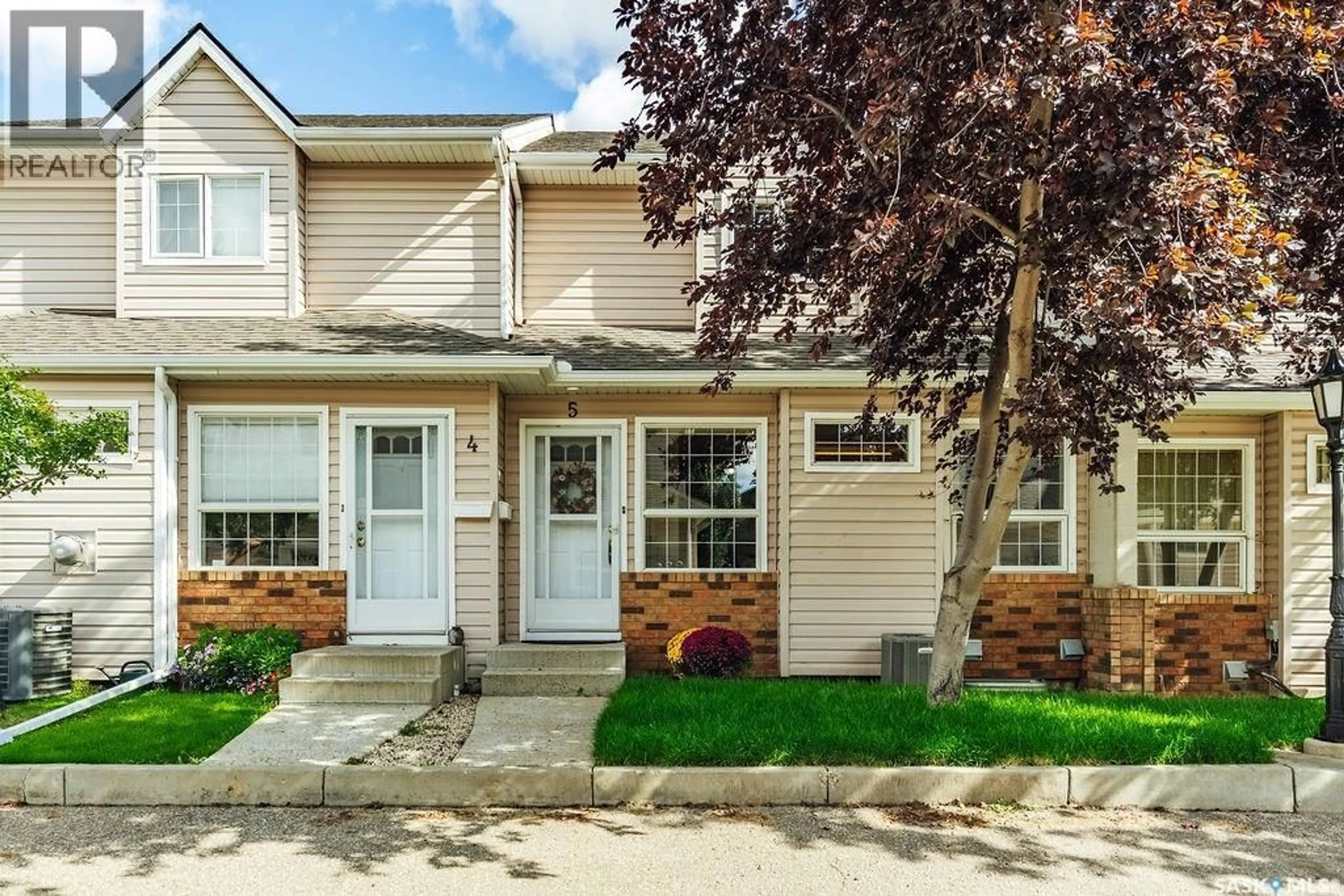 Home with vinyl exterior material, street for 102 - 5 WILLOW STREET, Saskatoon Saskatchewan S7J0C2
