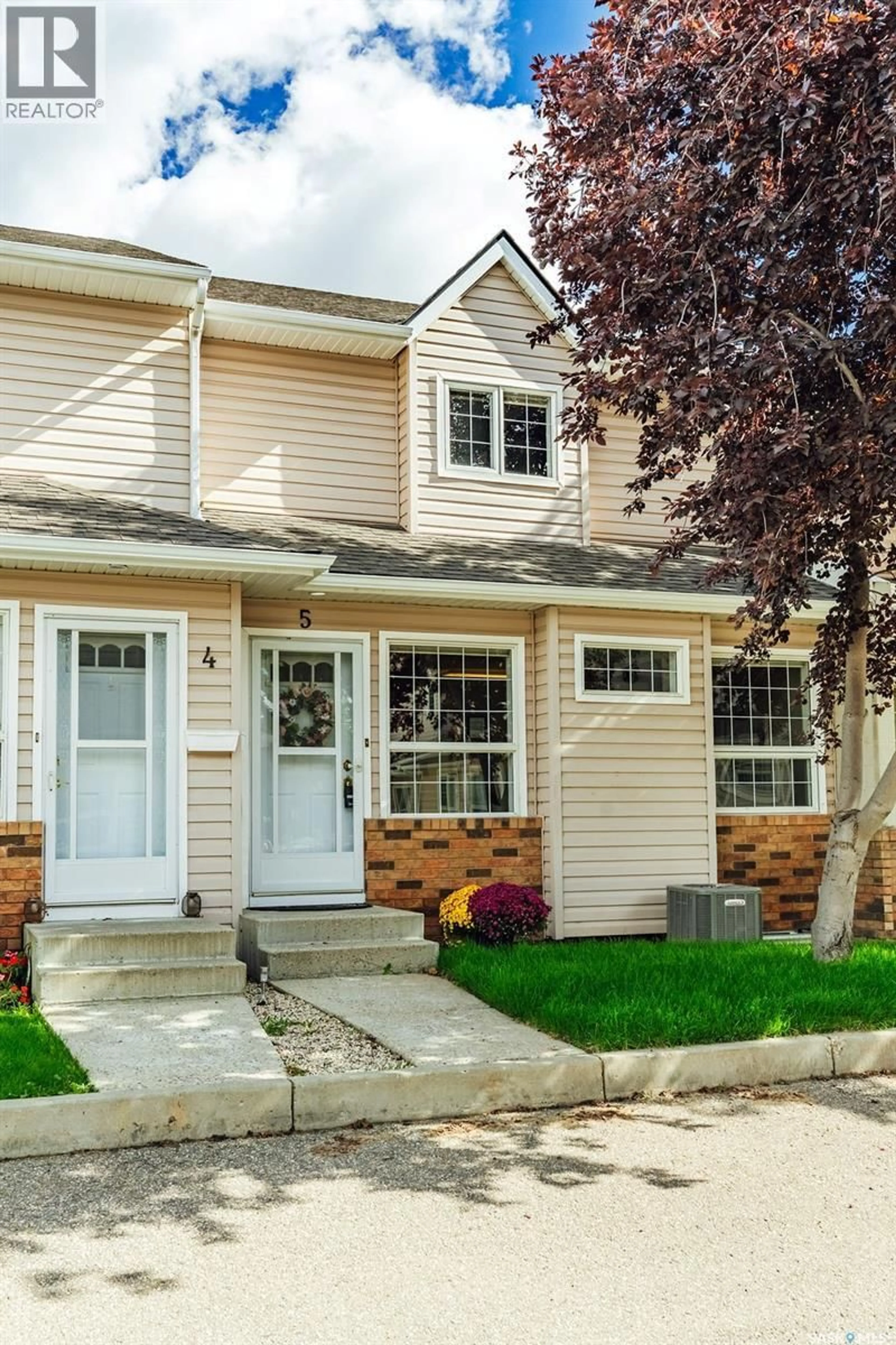 Home with vinyl exterior material, street for 102 - 5 WILLOW STREET, Saskatoon Saskatchewan S7J0C2