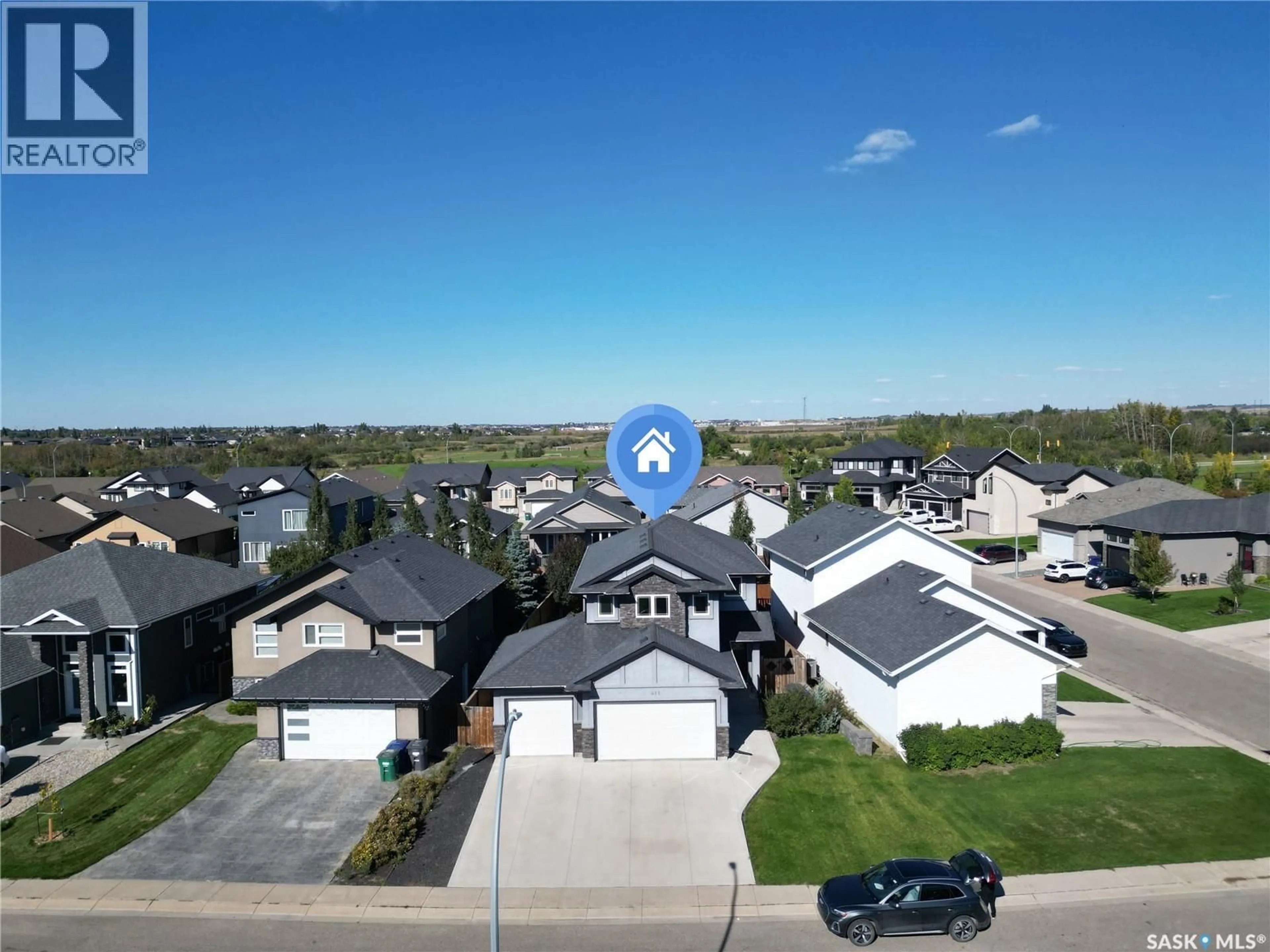 A pic from outside/outdoor area/front of a property/back of a property/a pic from drone, street for 411 HASTINGS CRESCENT, Saskatoon Saskatchewan S7V0C7