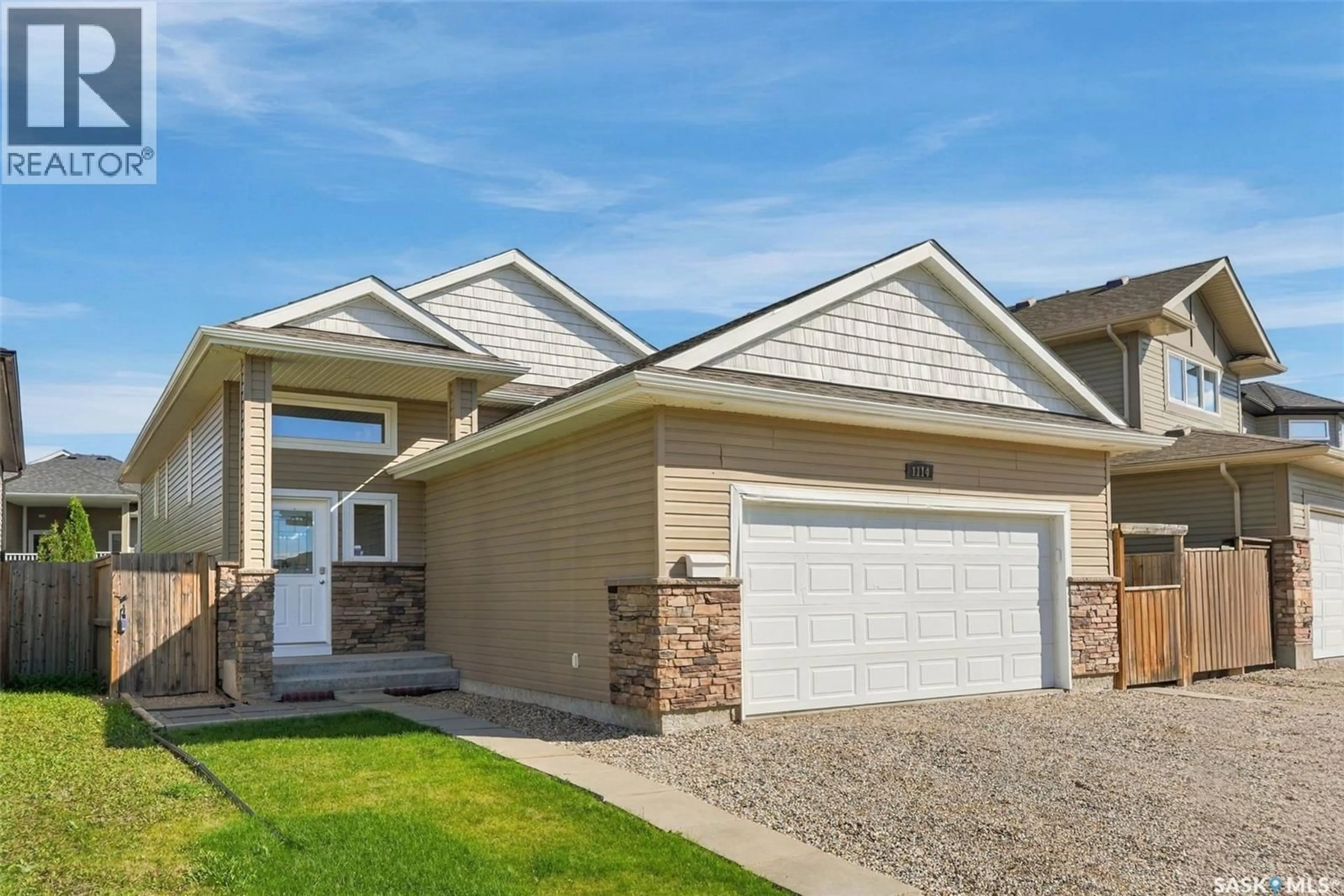 Home with vinyl exterior material, street for 1114 HARGREAVES WAY, Saskatoon Saskatchewan S7R0H2