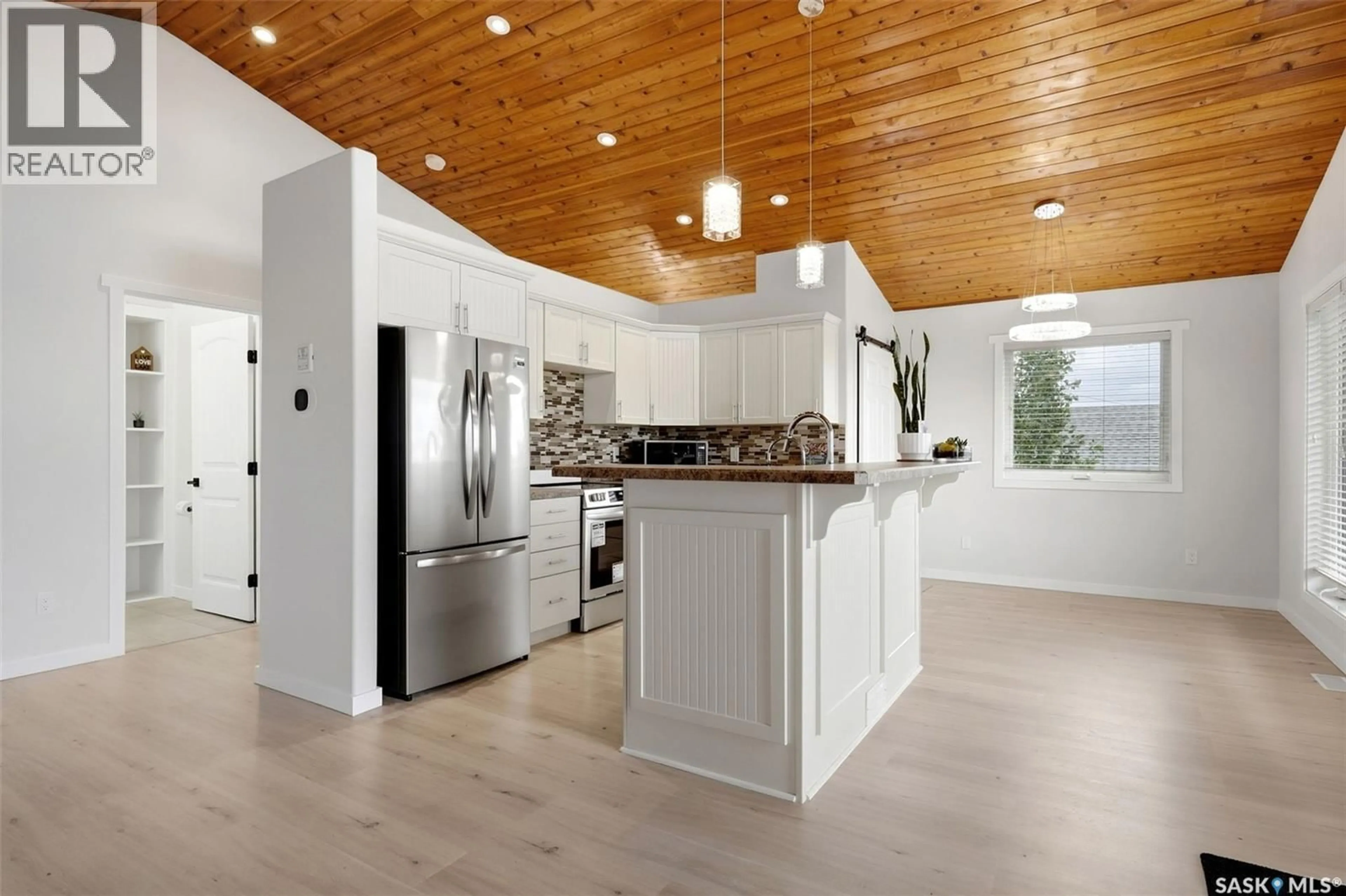 Open concept kitchen, wood/laminate floor for 414 WALTER STREET, Saskatchewan Beach Saskatchewan S0G4L0