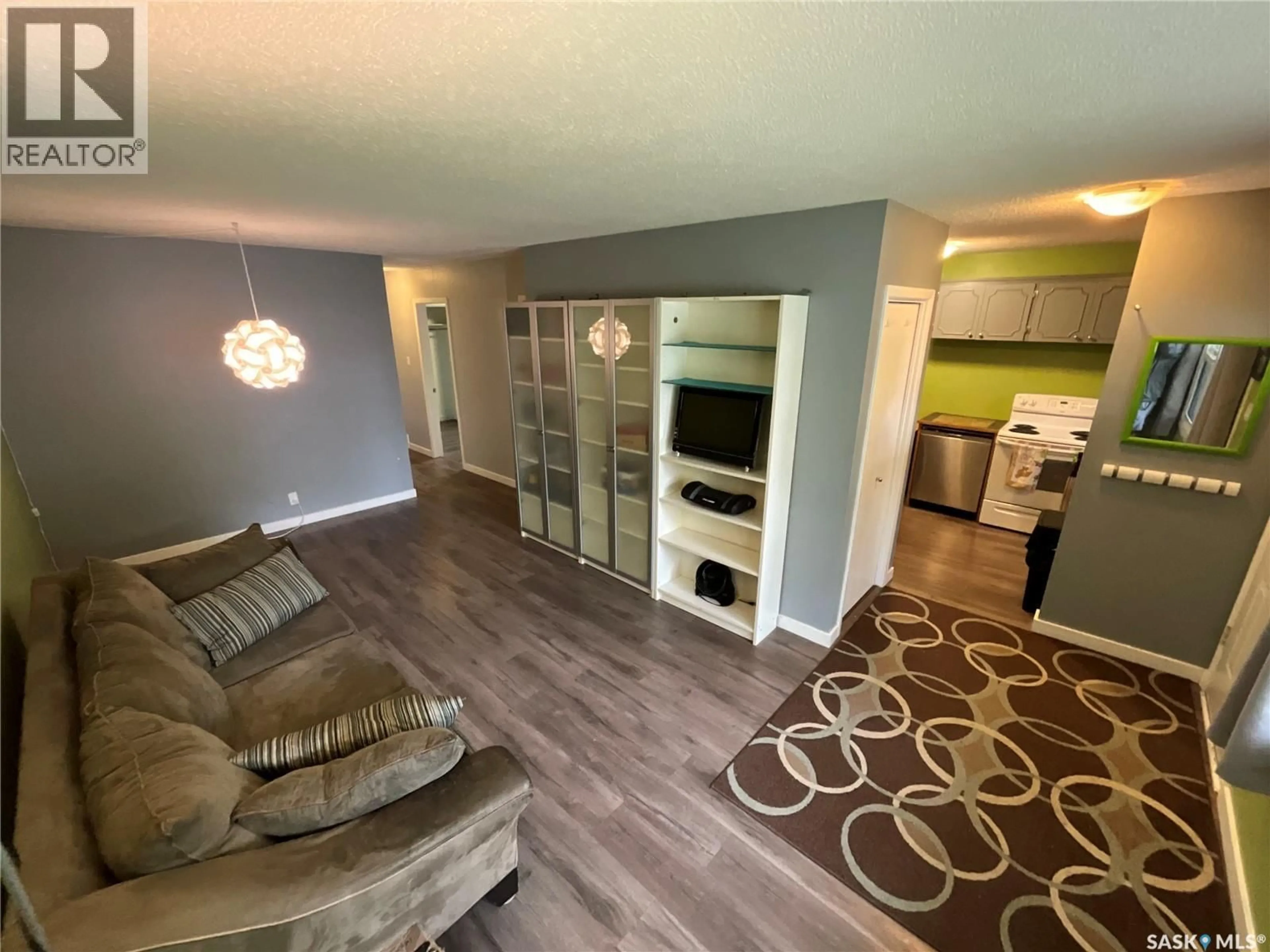 Living room with furniture, wood/laminate floor for 29 MCMURCHY AVENUE, Regina Saskatchewan S4R3G3