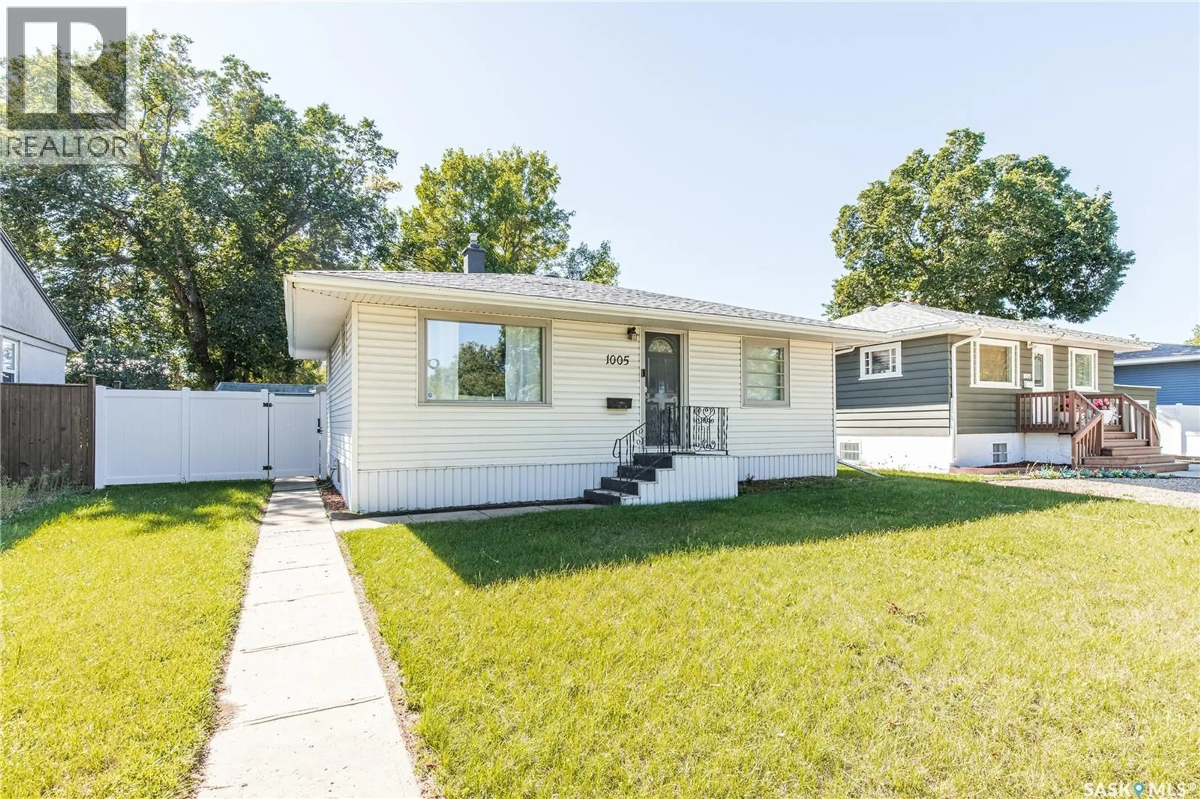 Home with vinyl exterior material, street for 1005 COTEAU STREET, Moose Jaw Saskatchewan S6H5G3