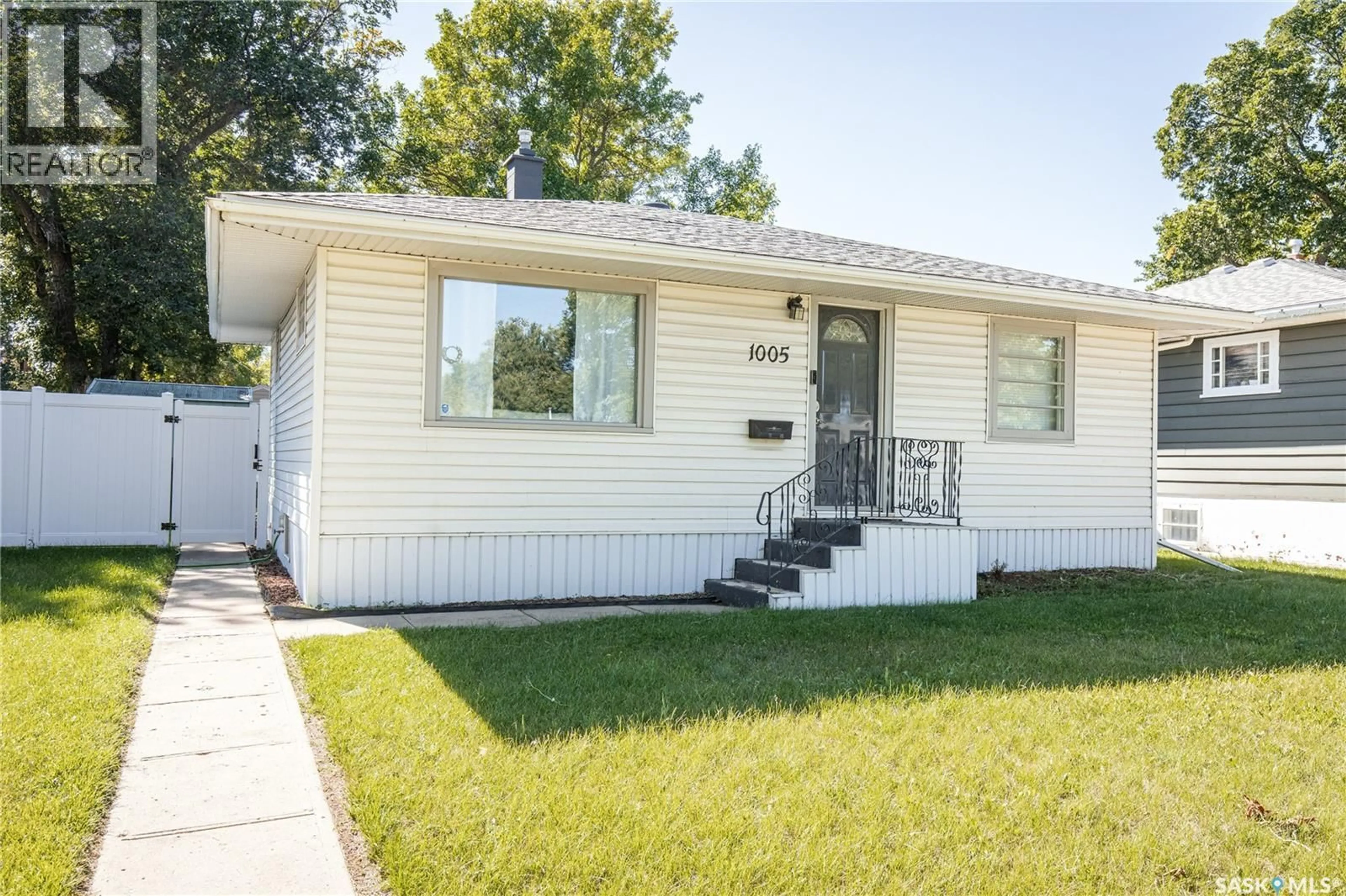Home with vinyl exterior material, street for 1005 COTEAU STREET, Moose Jaw Saskatchewan S6H5G3