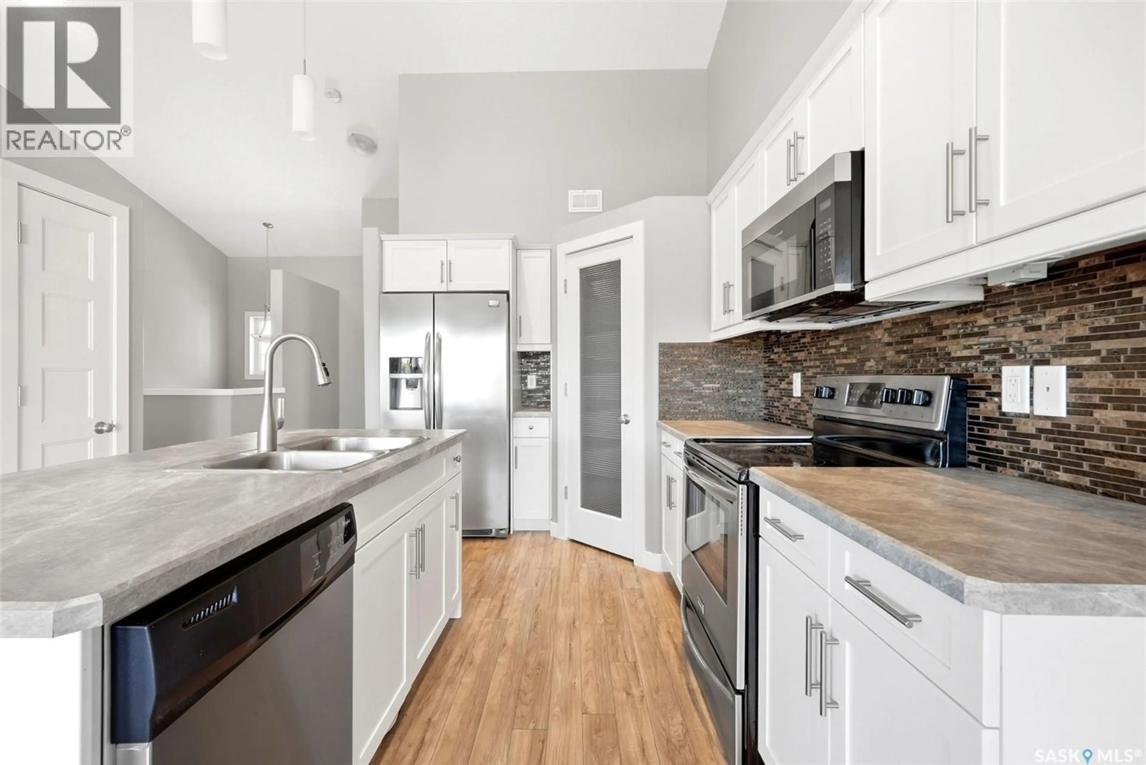 Open concept kitchen, ceramic/tile floor for 4493 JAMES HILL ROAD, Regina Saskatchewan S4W0K5