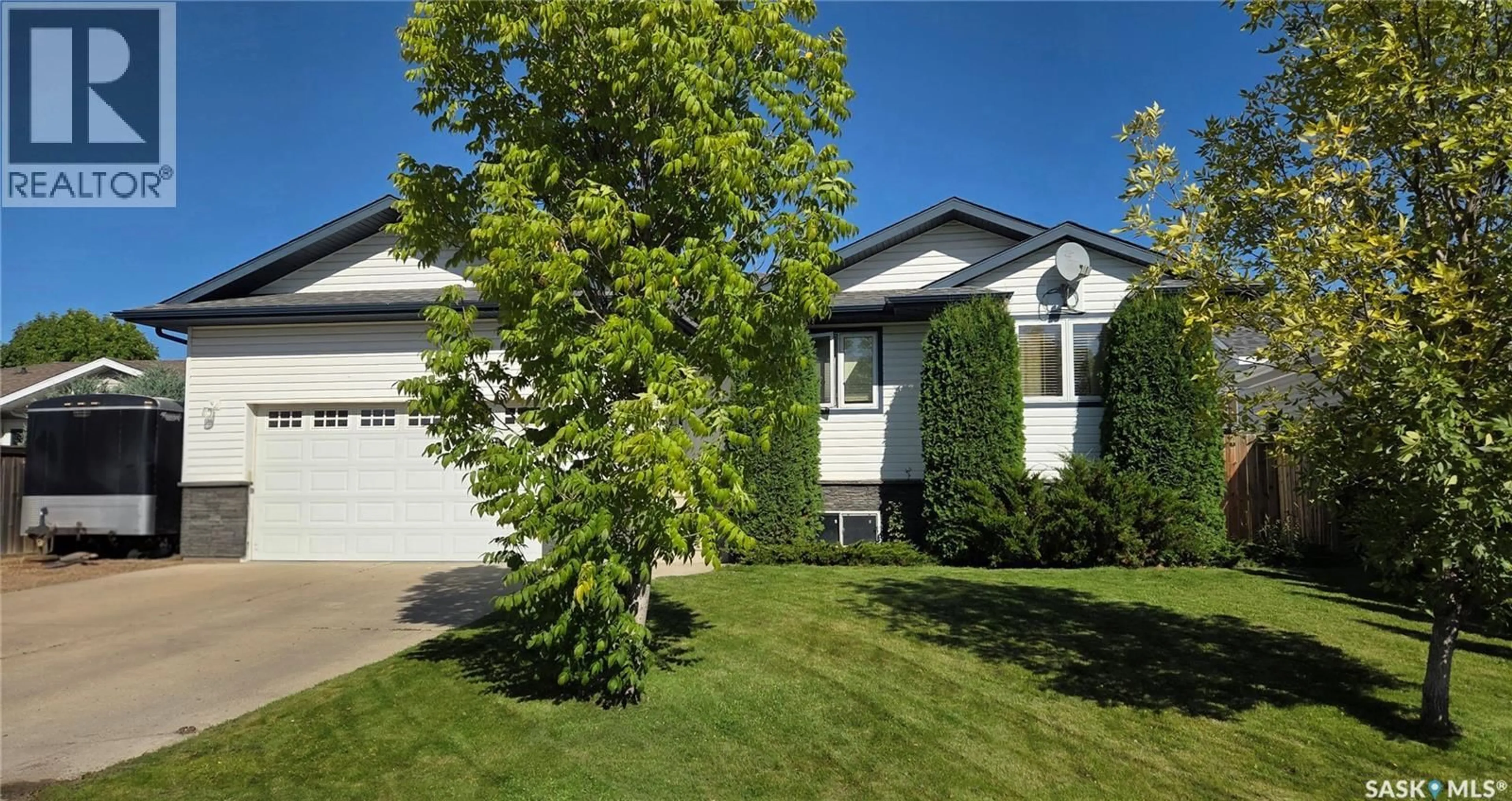 Home with vinyl exterior material, street for 10305 HOCK AVENUE, North Battleford Saskatchewan S9A3Y3