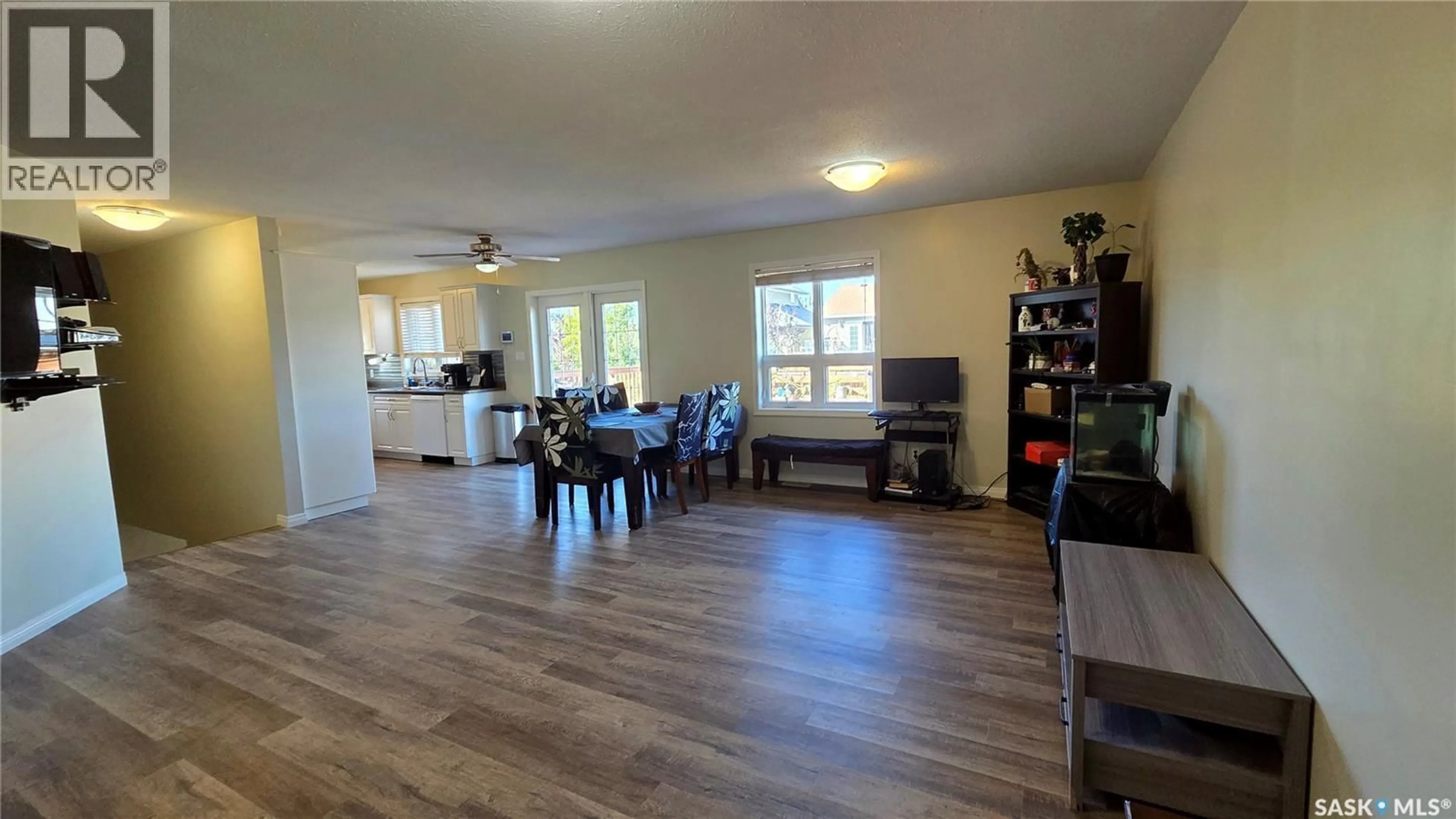 Living room with furniture, wood/laminate floor for 10305 HOCK AVENUE, North Battleford Saskatchewan S9A3Y3
