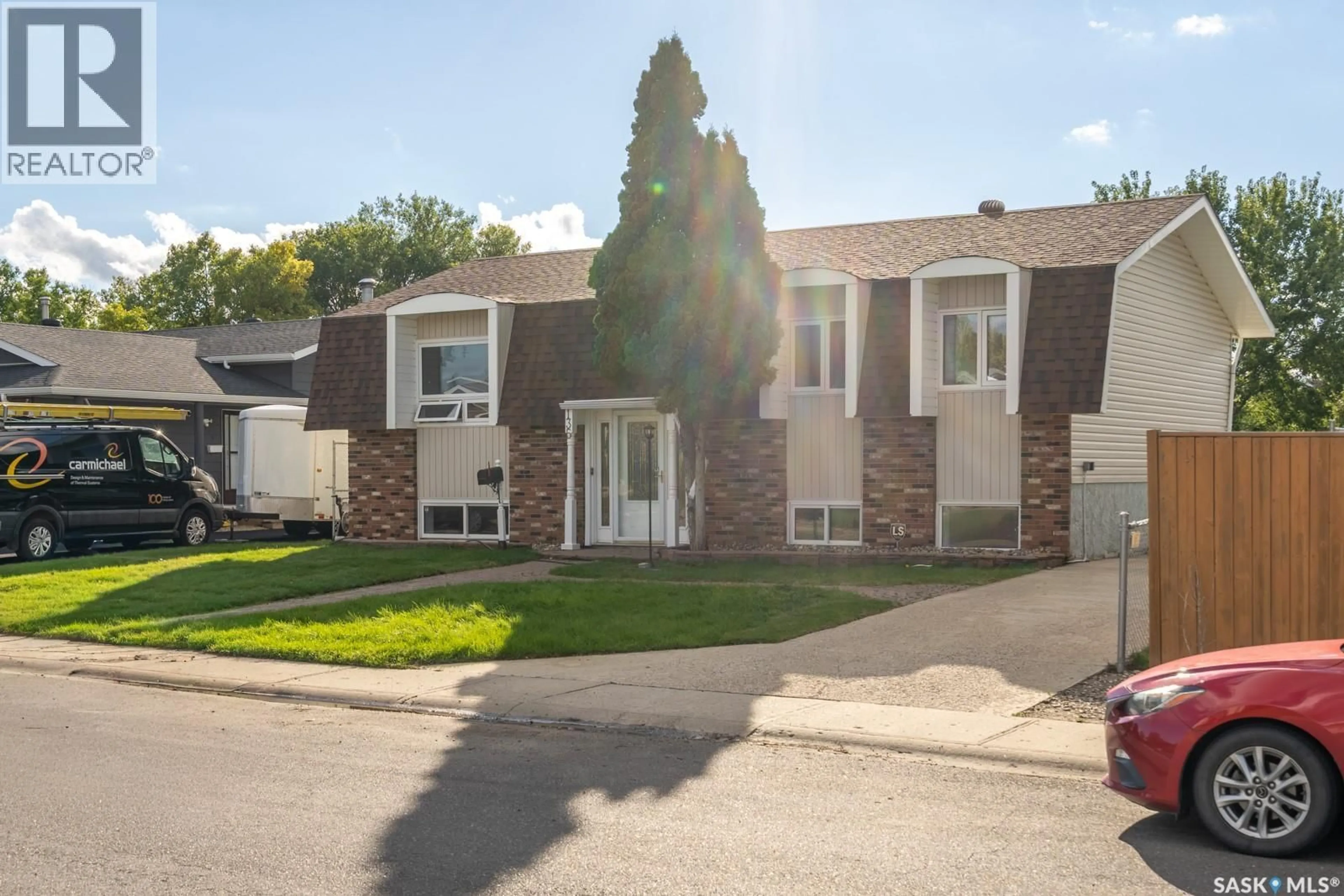 Home with vinyl exterior material, street for 135 FULTON DRIVE, Regina Saskatchewan S4X1A6