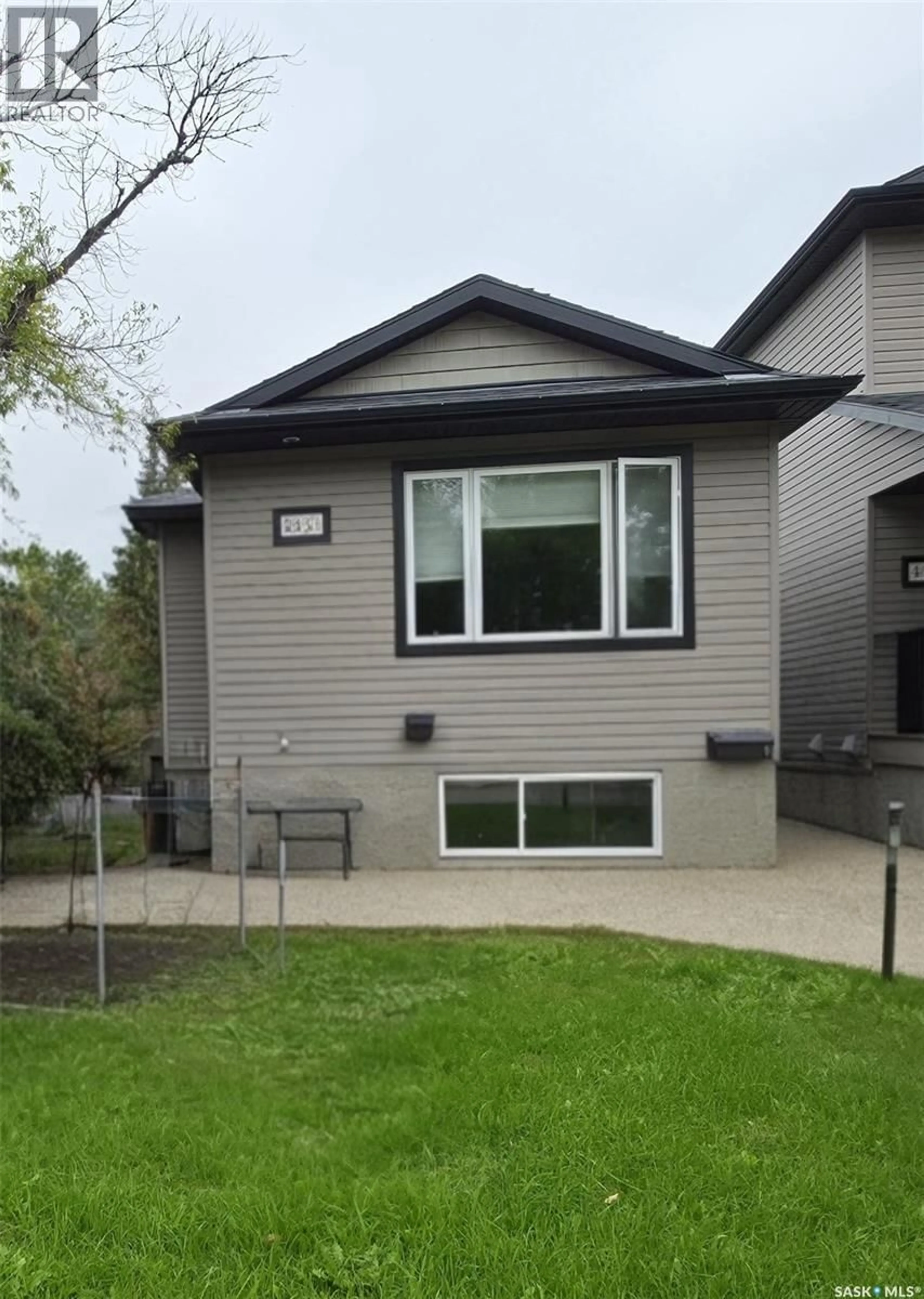 Home with vinyl exterior material, street for 463 HALIFAX STREET, Regina Saskatchewan S4R1T4