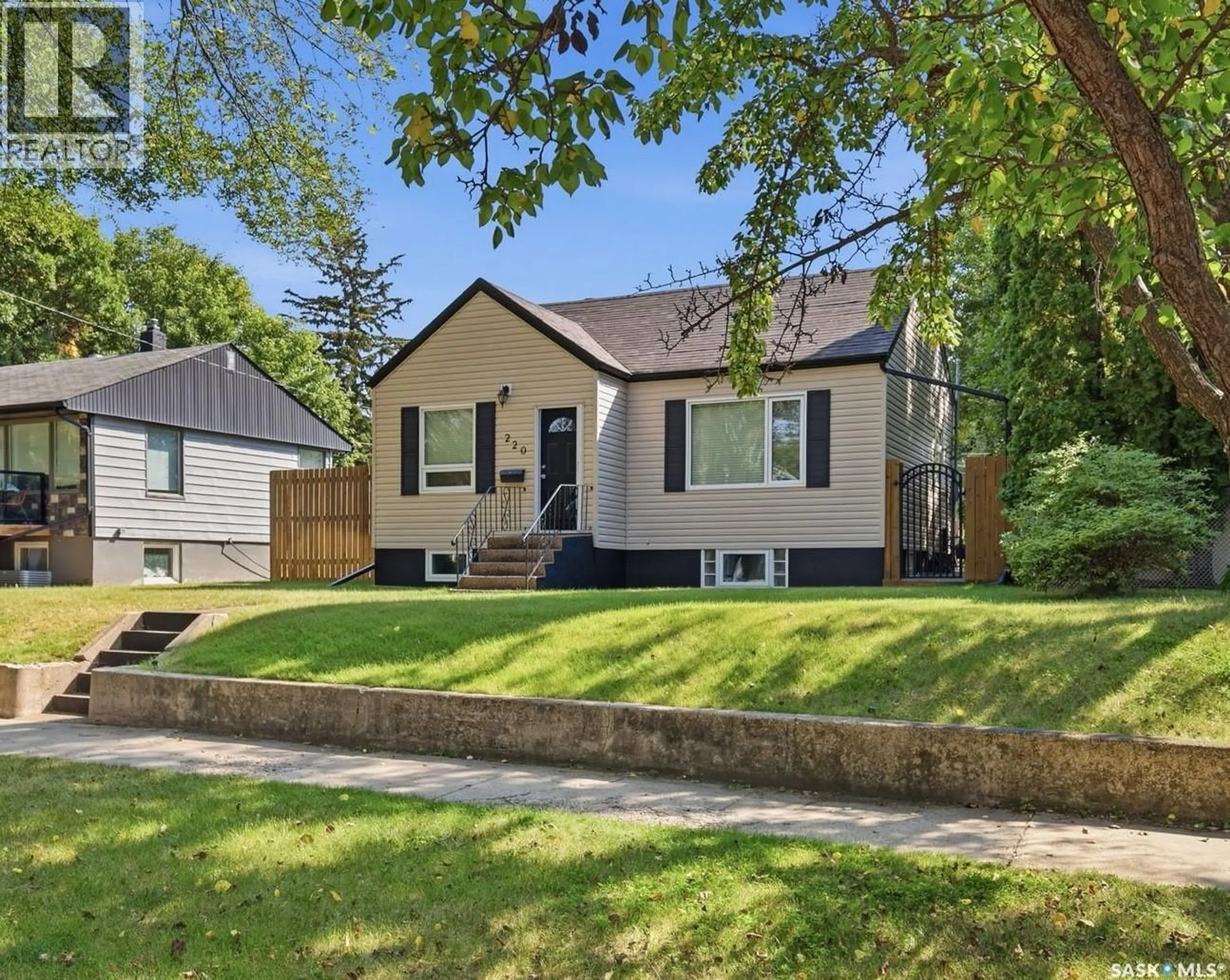 Home with vinyl exterior material, street for 220 3RD STREET, Saskatoon Saskatchewan S7H1L3
