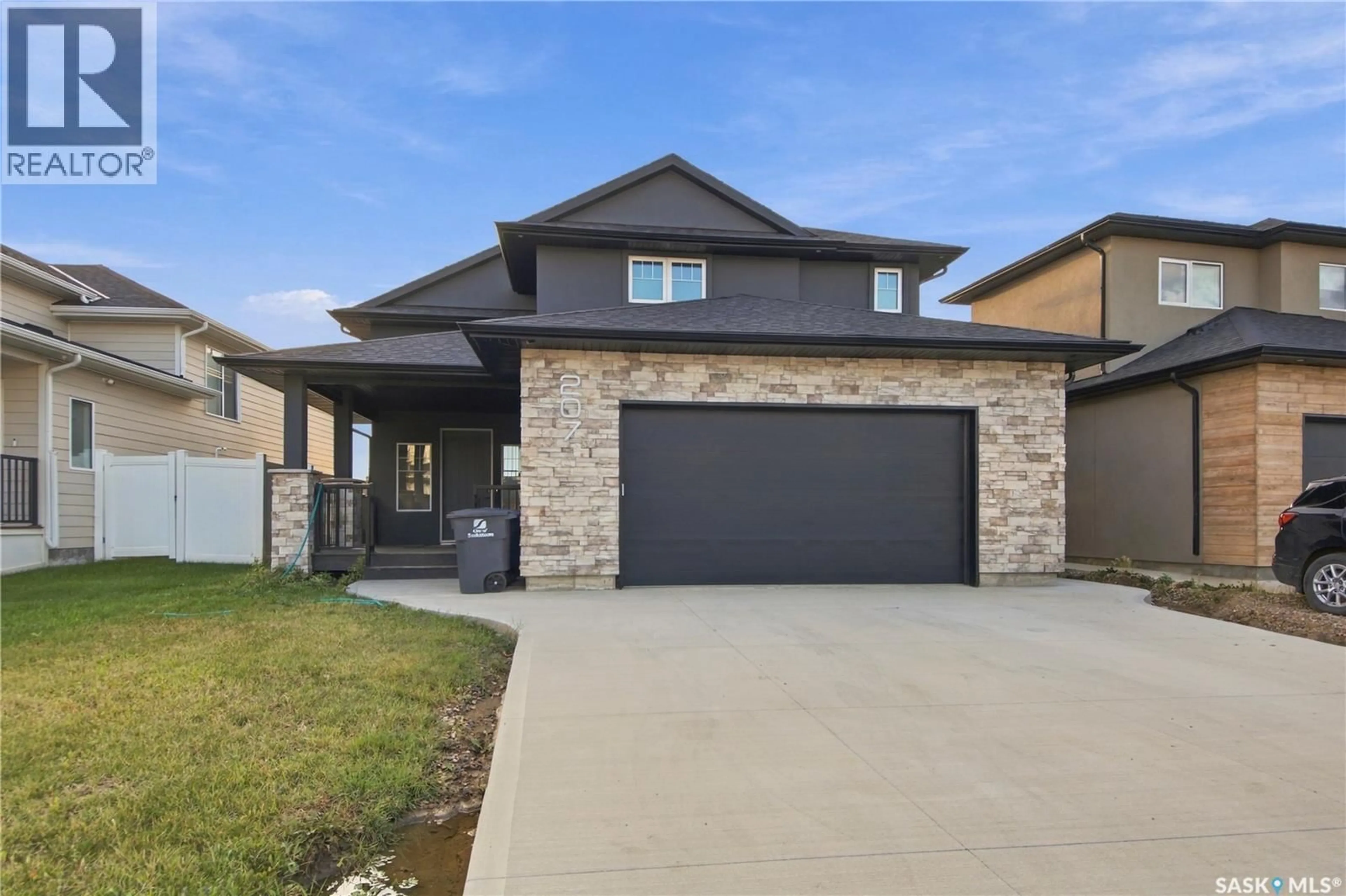 Home with brick exterior material, street for 207 GREYEYES-STEELE WAY, Saskatoon Saskatchewan S7V0M6