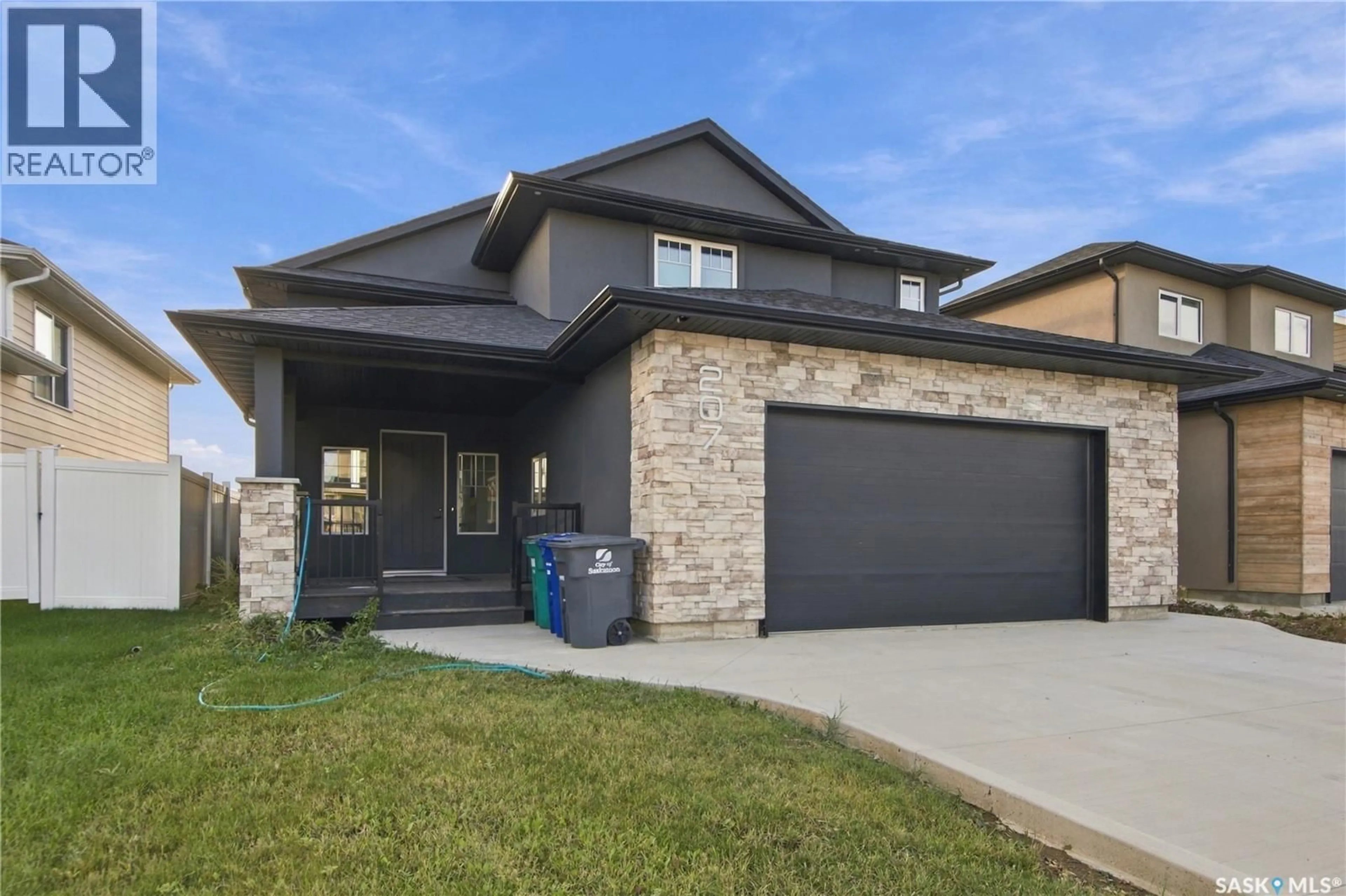 Home with brick exterior material, street for 207 GREYEYES-STEELE WAY, Saskatoon Saskatchewan S7V0M6