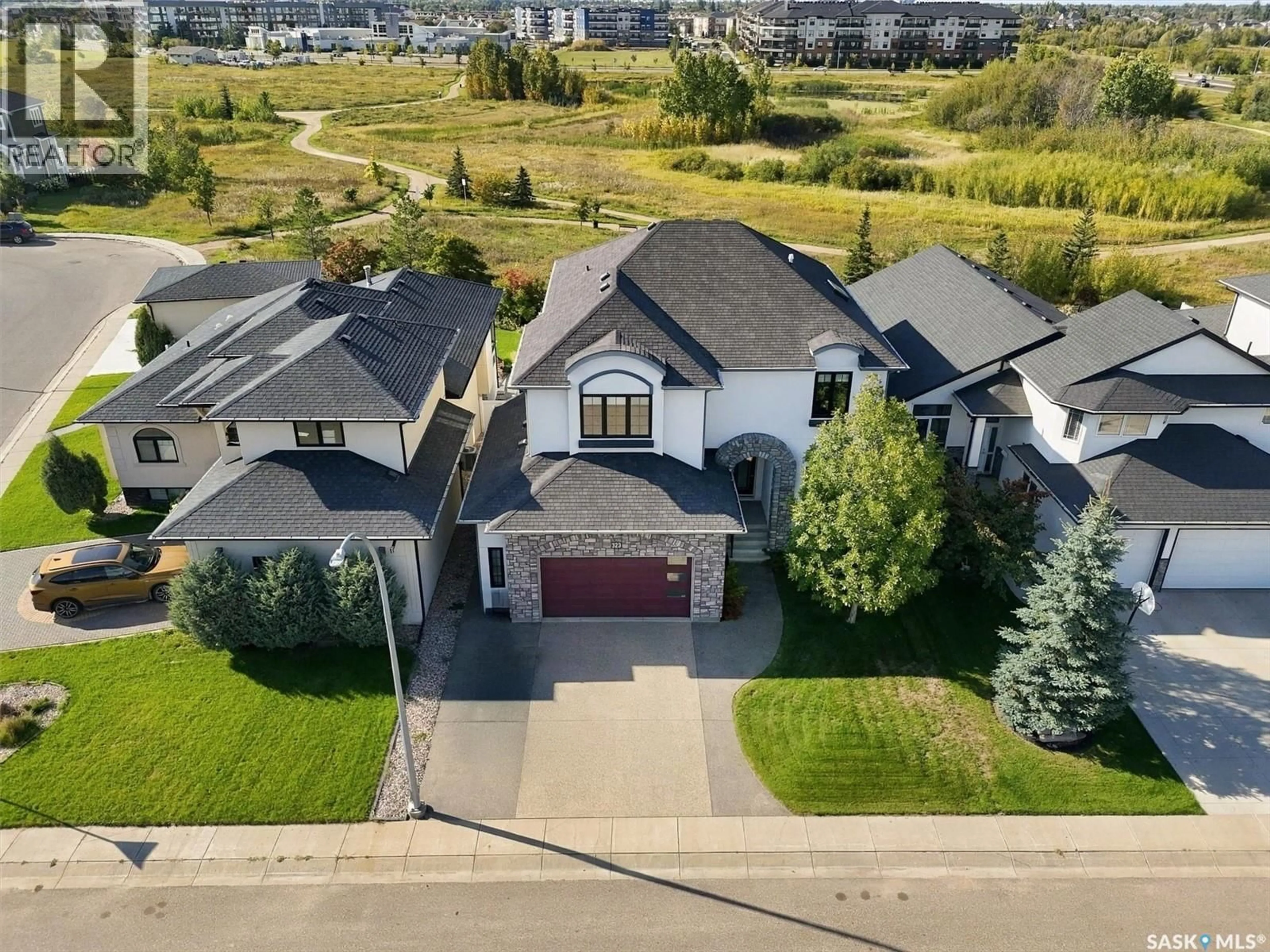 A pic from outside/outdoor area/front of a property/back of a property/a pic from drone, street for 323 HASTINGS LANE, Saskatoon Saskatchewan S7V0C8