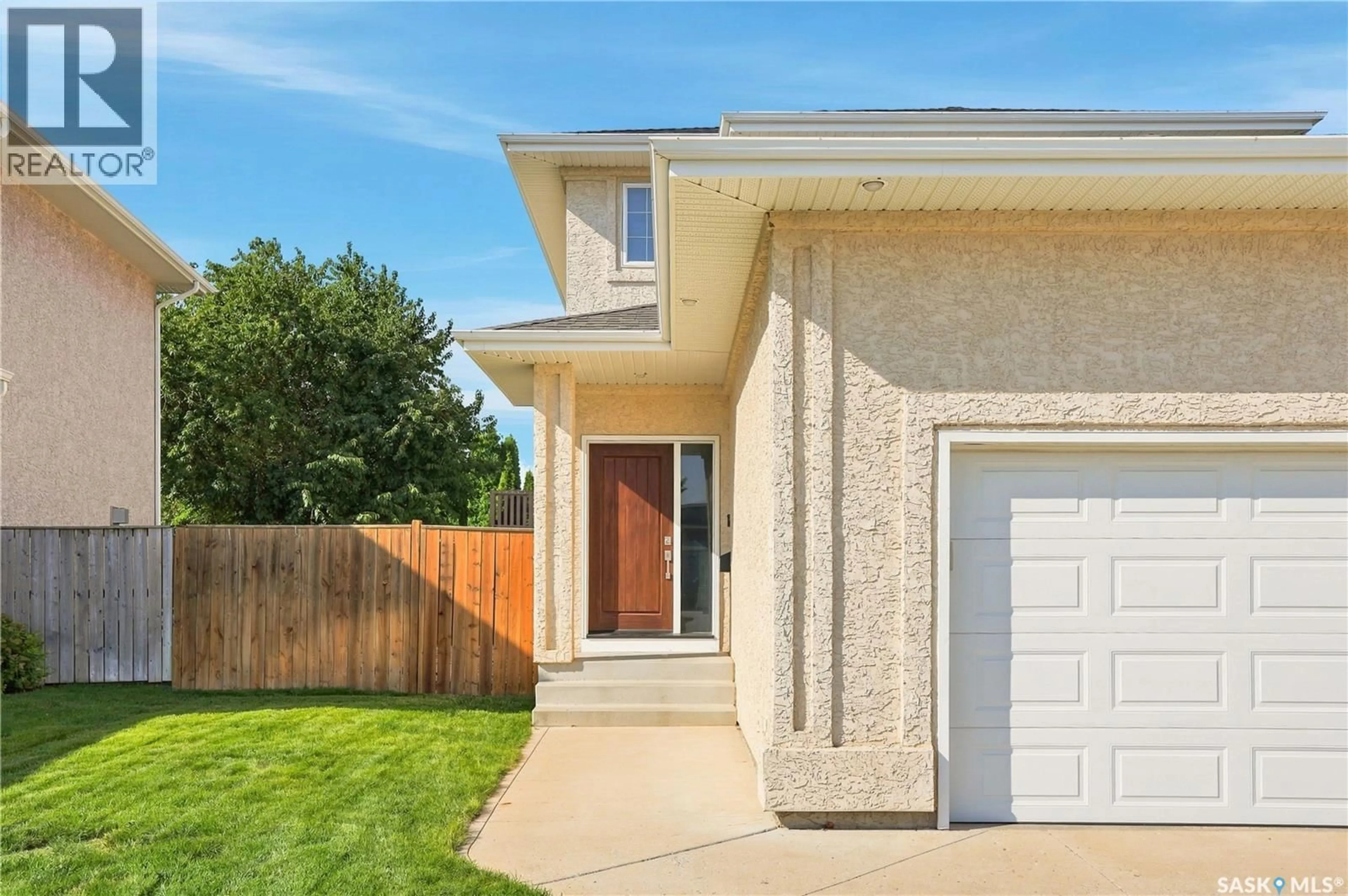 Home with vinyl exterior material, street for 106 SEARS COVE, Saskatoon Saskatchewan S7N4V5