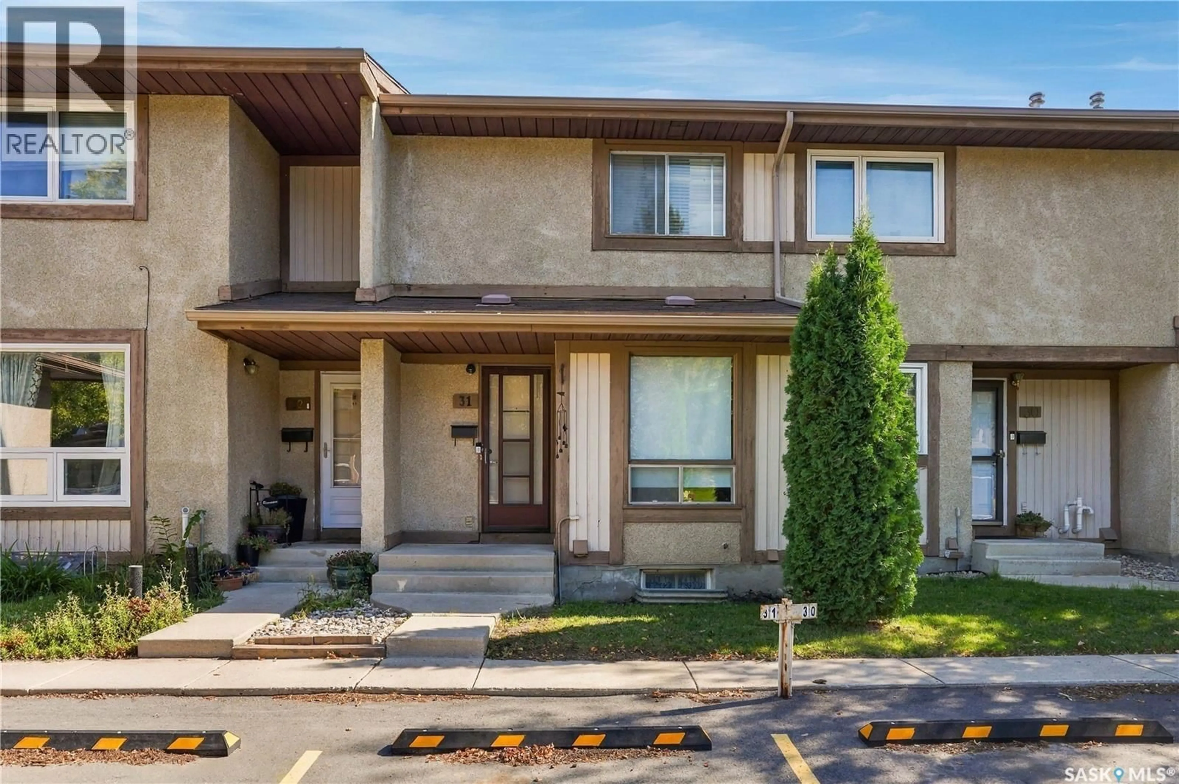 Home with vinyl exterior material, street for 31 1128 MCKERCHER DRIVE, Saskatoon Saskatchewan S7H4Y7