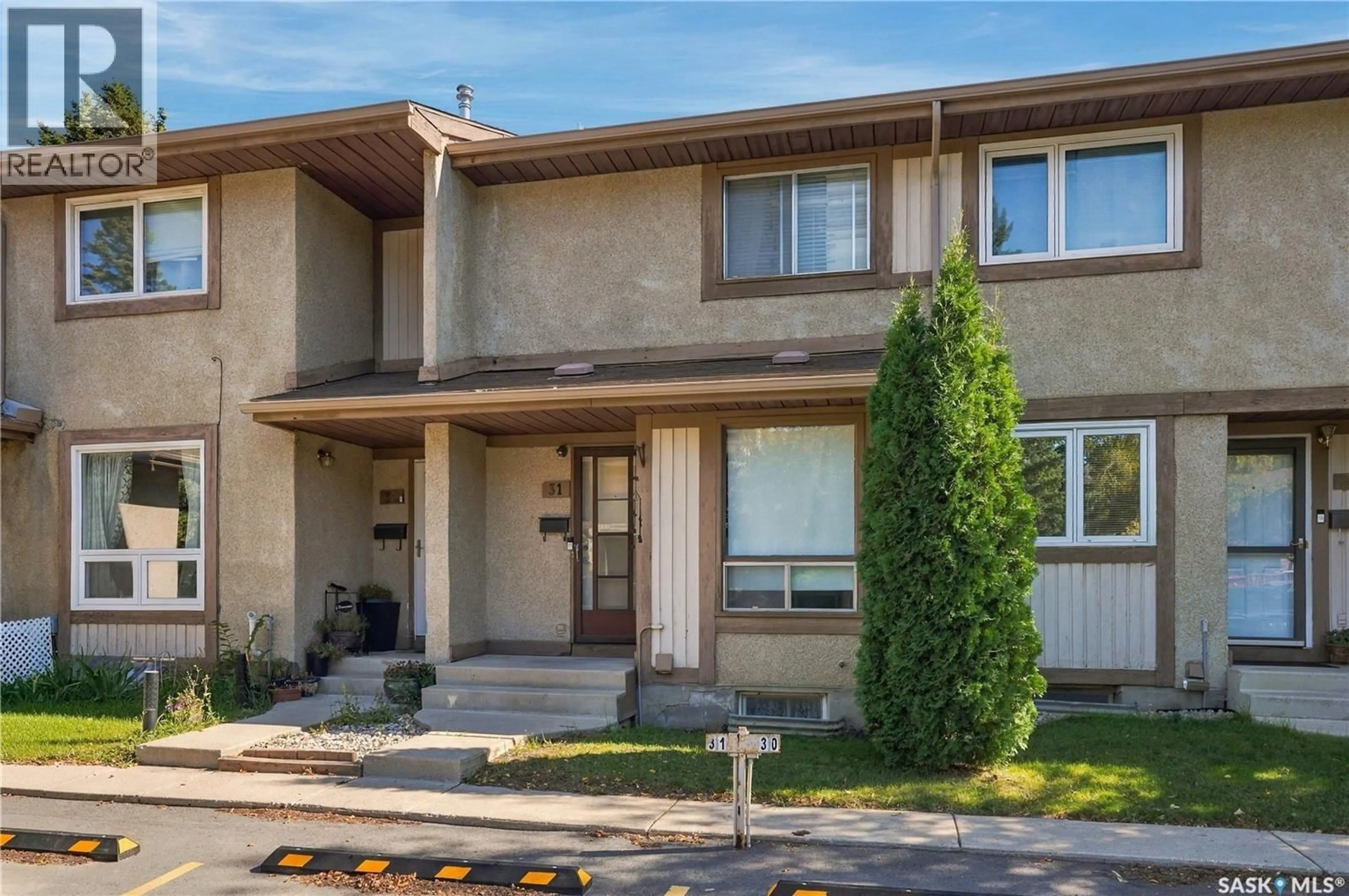 Home with vinyl exterior material, street for 31 1128 MCKERCHER DRIVE, Saskatoon Saskatchewan S7H4Y7
