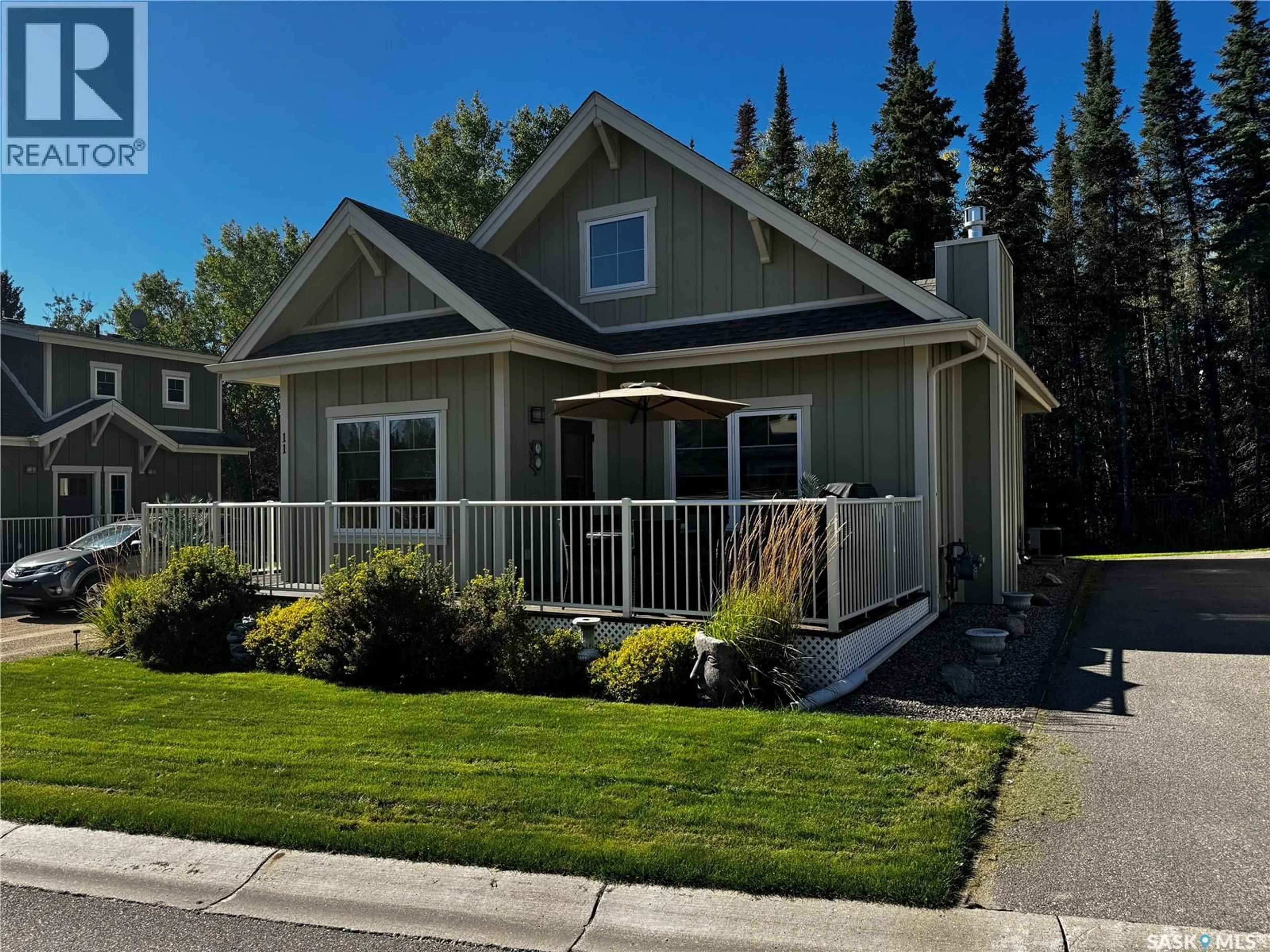 Home with vinyl exterior material, street for 11 COTTAGE CRESCENT, Elk Ridge Saskatchewan S0J2Y0