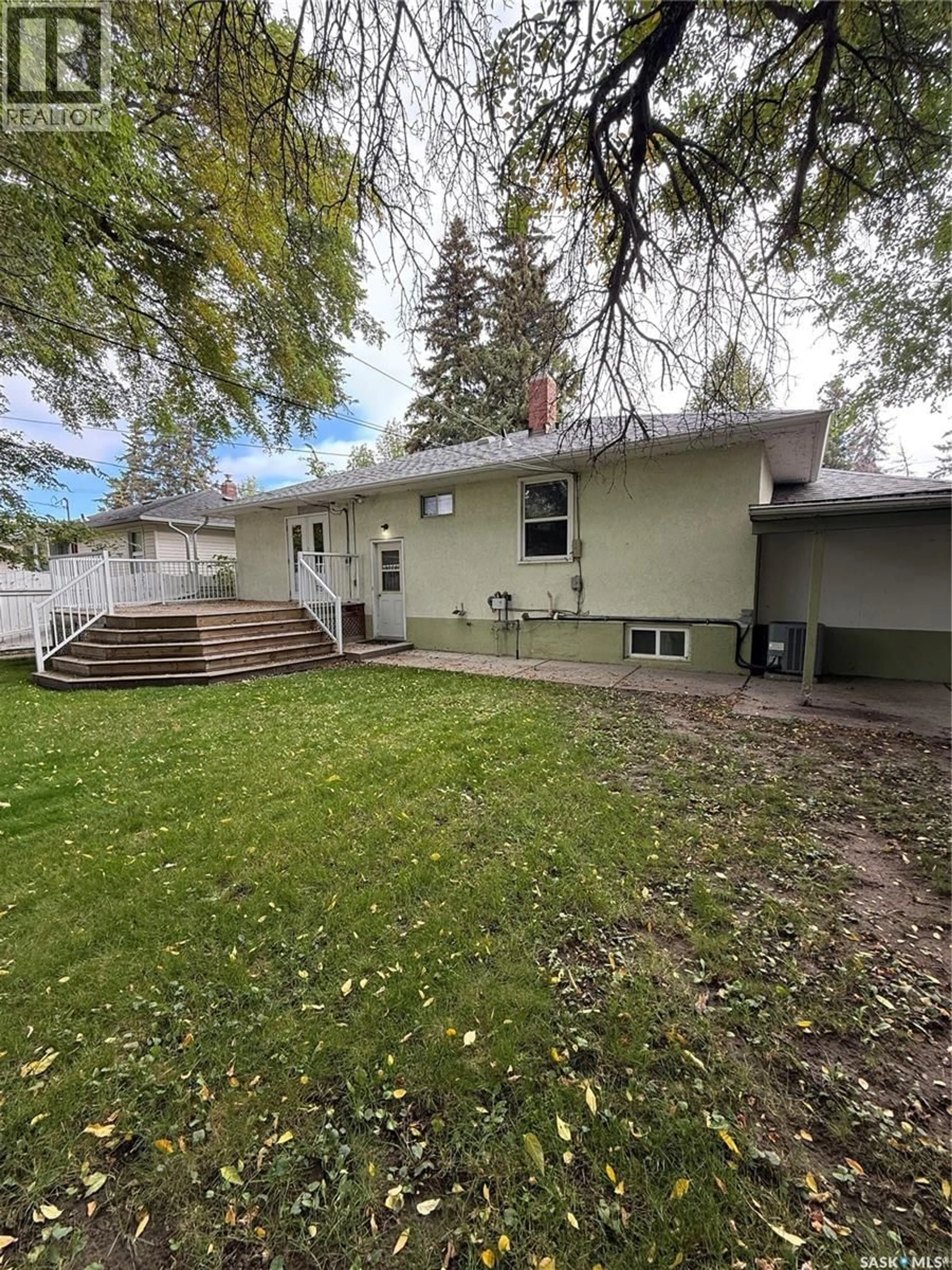Home with vinyl exterior material, street for 1204 EWART AVENUE, Saskatoon Saskatchewan S7H2K3