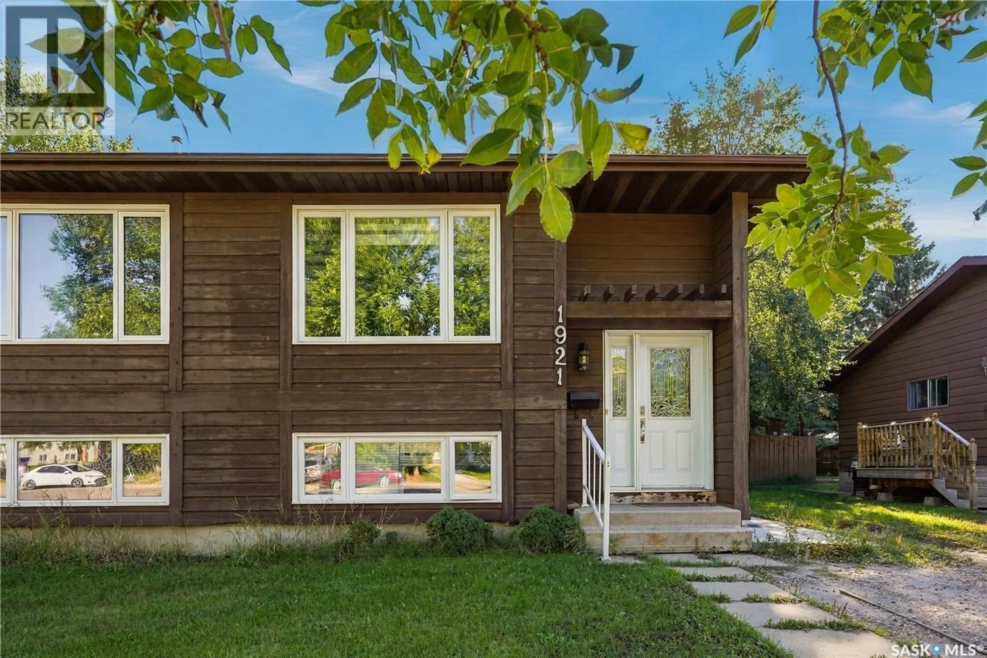Home with vinyl exterior material, street for 1921 MCKERCHER DRIVE, Saskatoon Saskatchewan S7J3W1