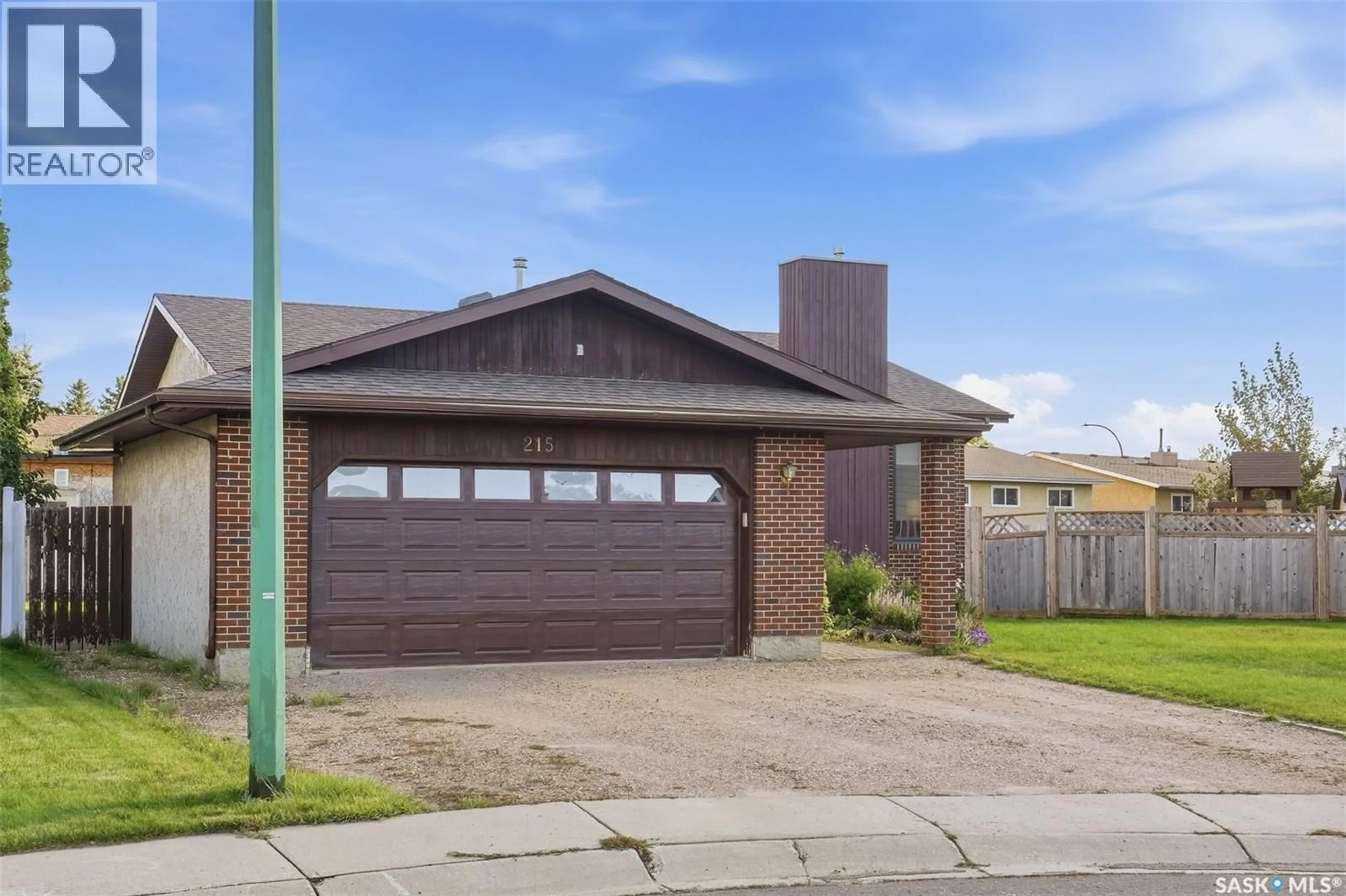 Home with brick exterior material, street for 215 CALDWELL COURT, Saskatoon Saskatchewan S7M5S7
