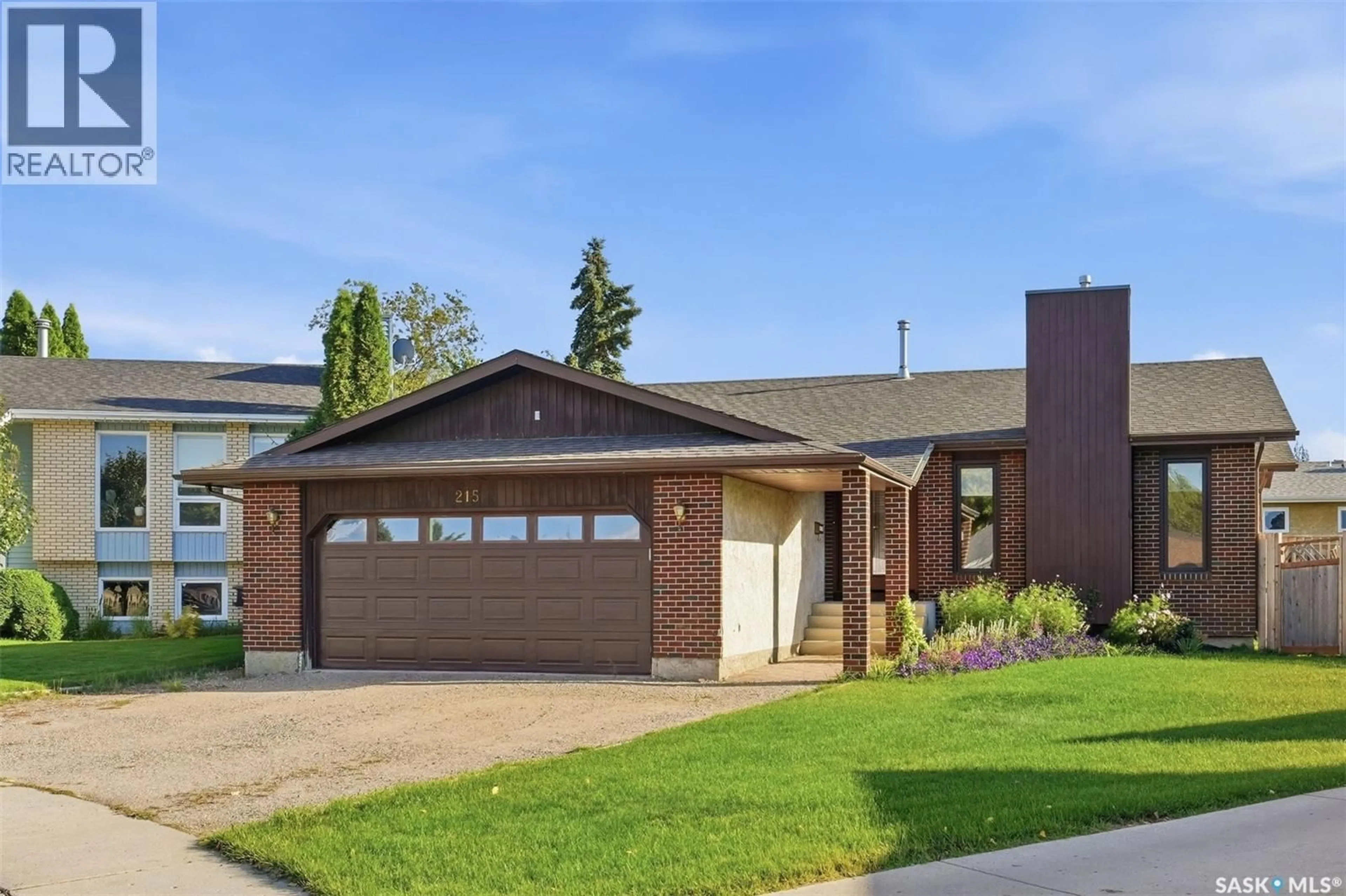 Home with brick exterior material, street for 215 CALDWELL COURT, Saskatoon Saskatchewan S7M5S7