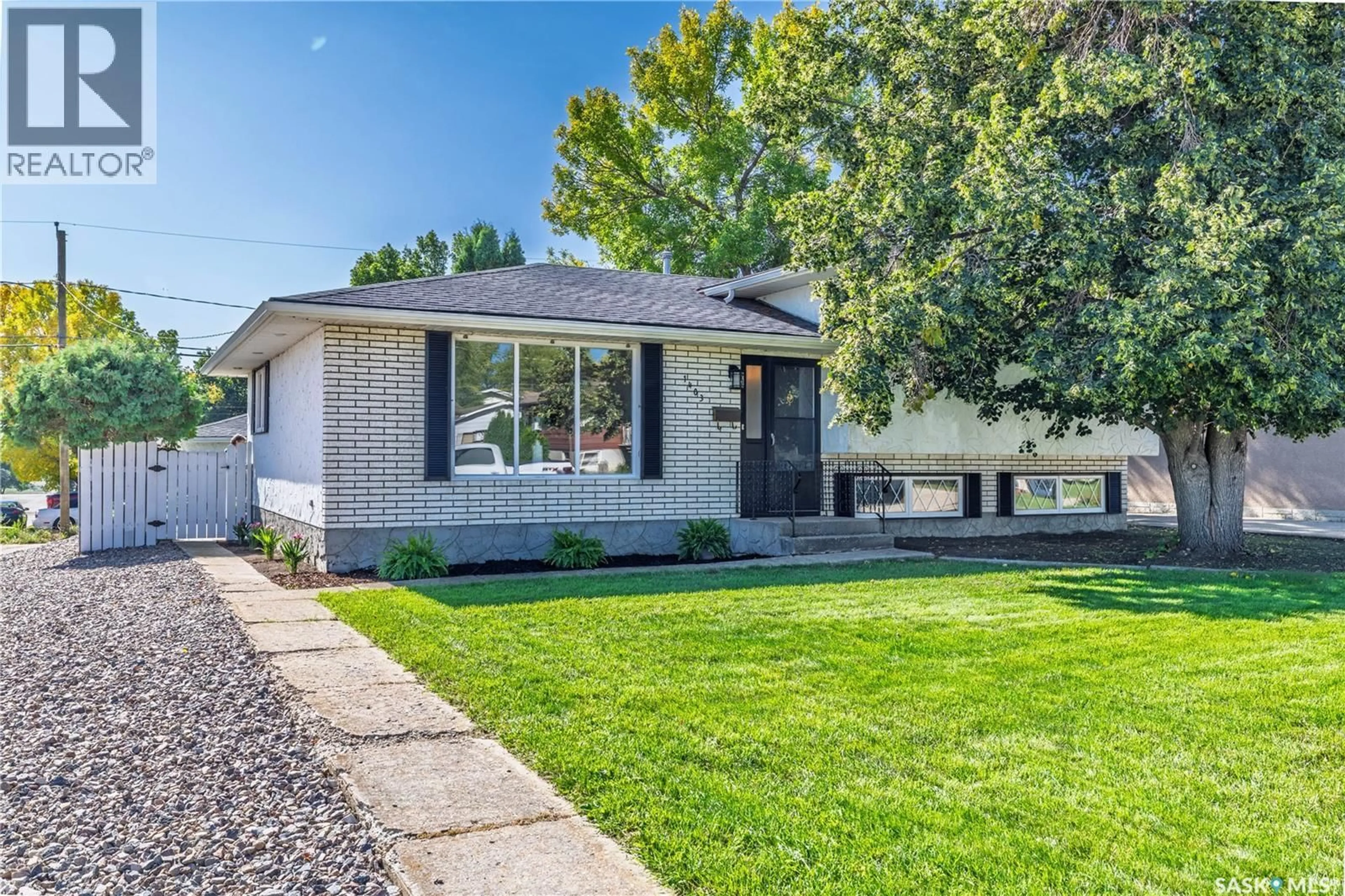 Home with vinyl exterior material, street for 1403 HOCHELAGA STREET, Moose Jaw Saskatchewan S6H6G6