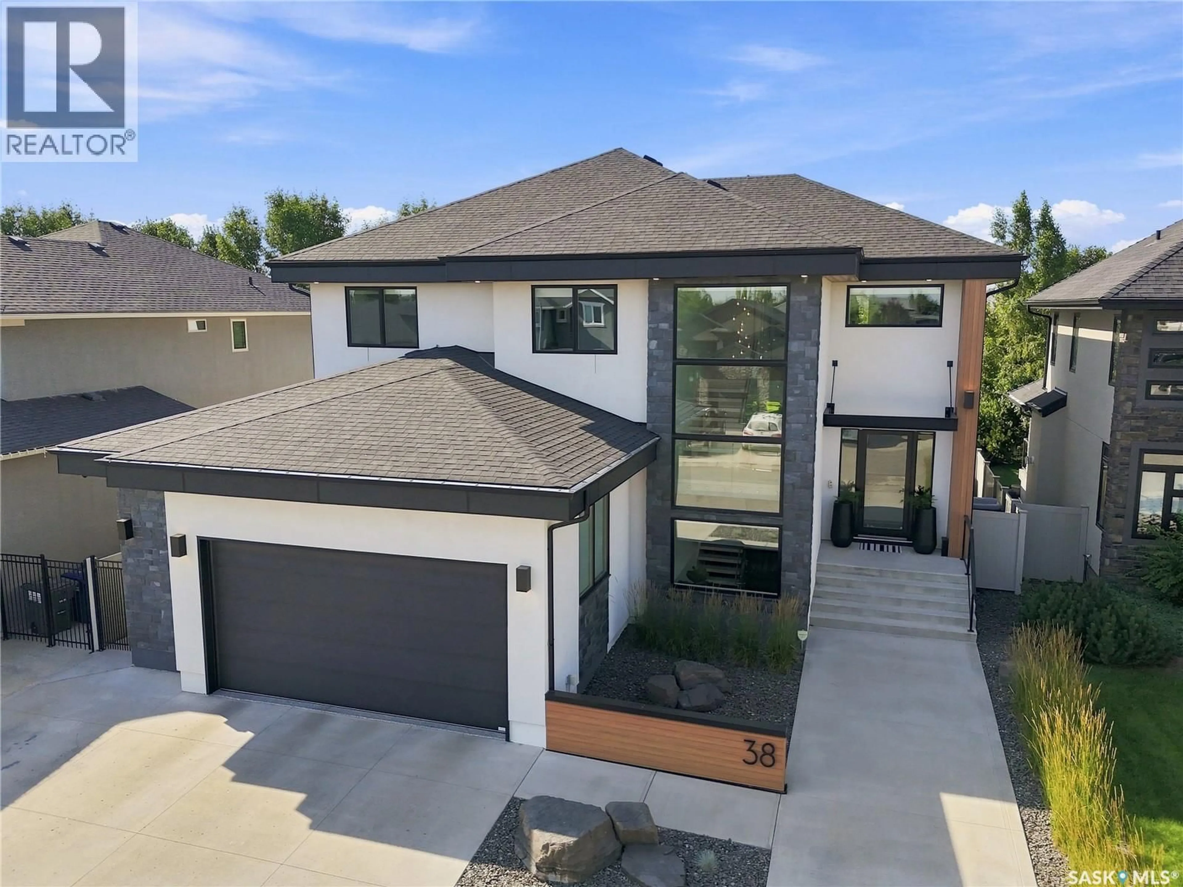 Home with brick exterior material, street for 38 WRIGHT MANOR, Saskatoon Saskatchewan S7N2C9