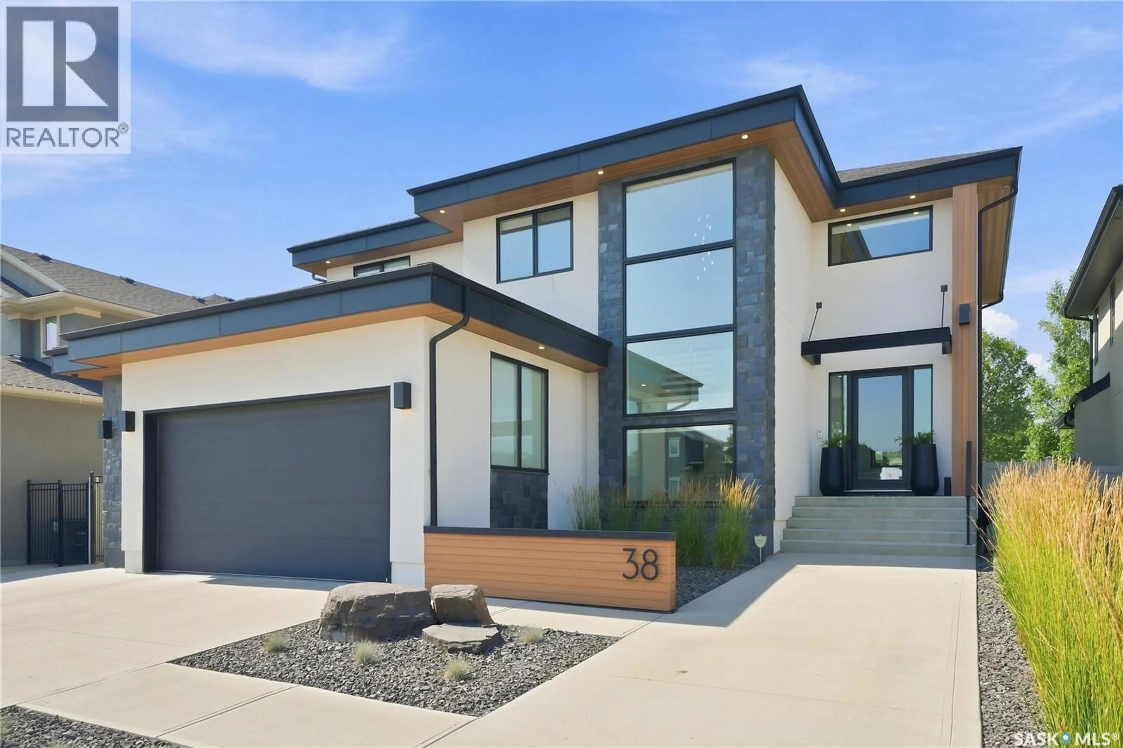 Home with brick exterior material, street for 38 WRIGHT MANOR, Saskatoon Saskatchewan S7N2C9