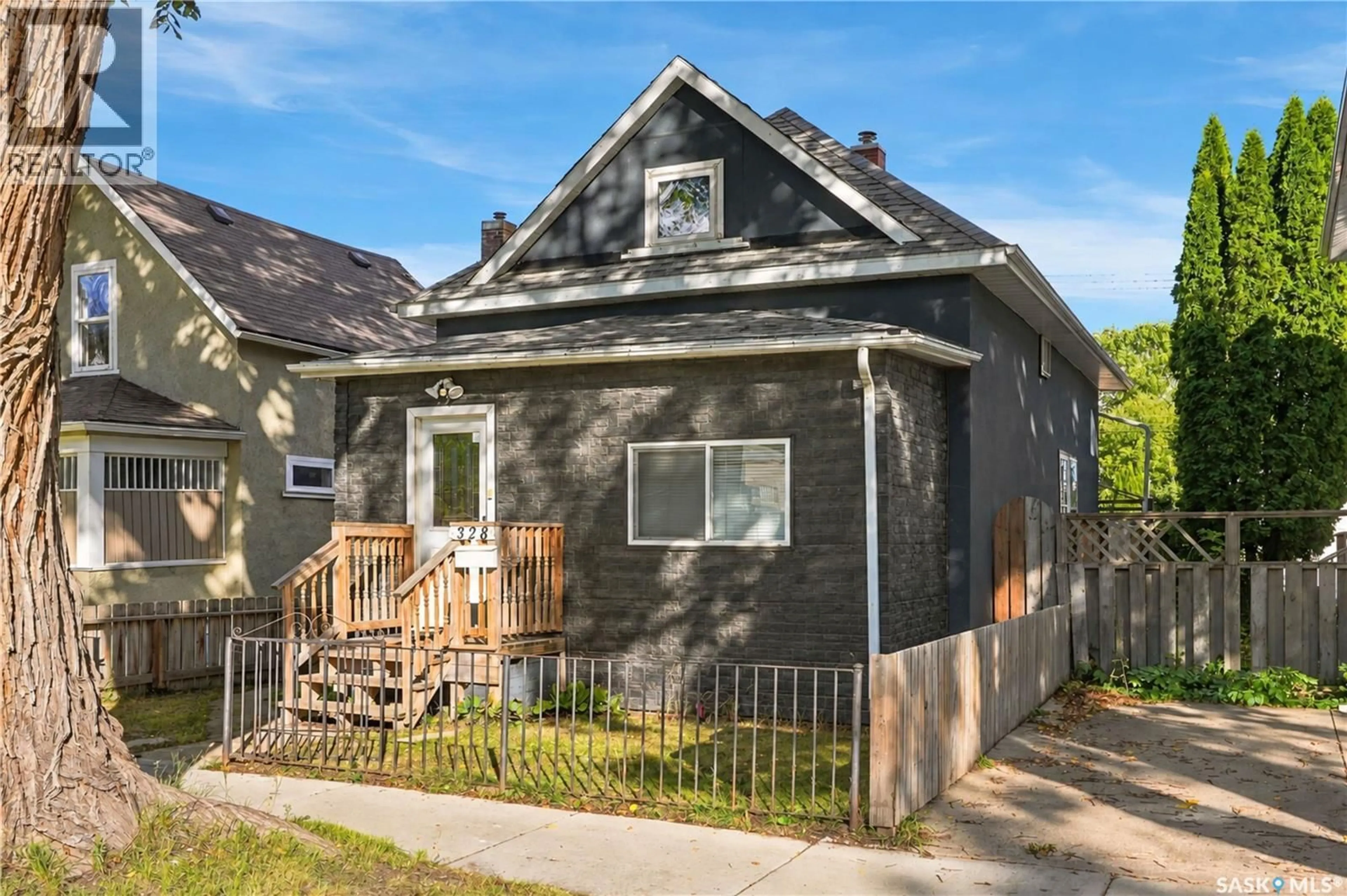 Home with vinyl exterior material, street for 328 I AVENUE, Saskatoon Saskatchewan S7M1Y2