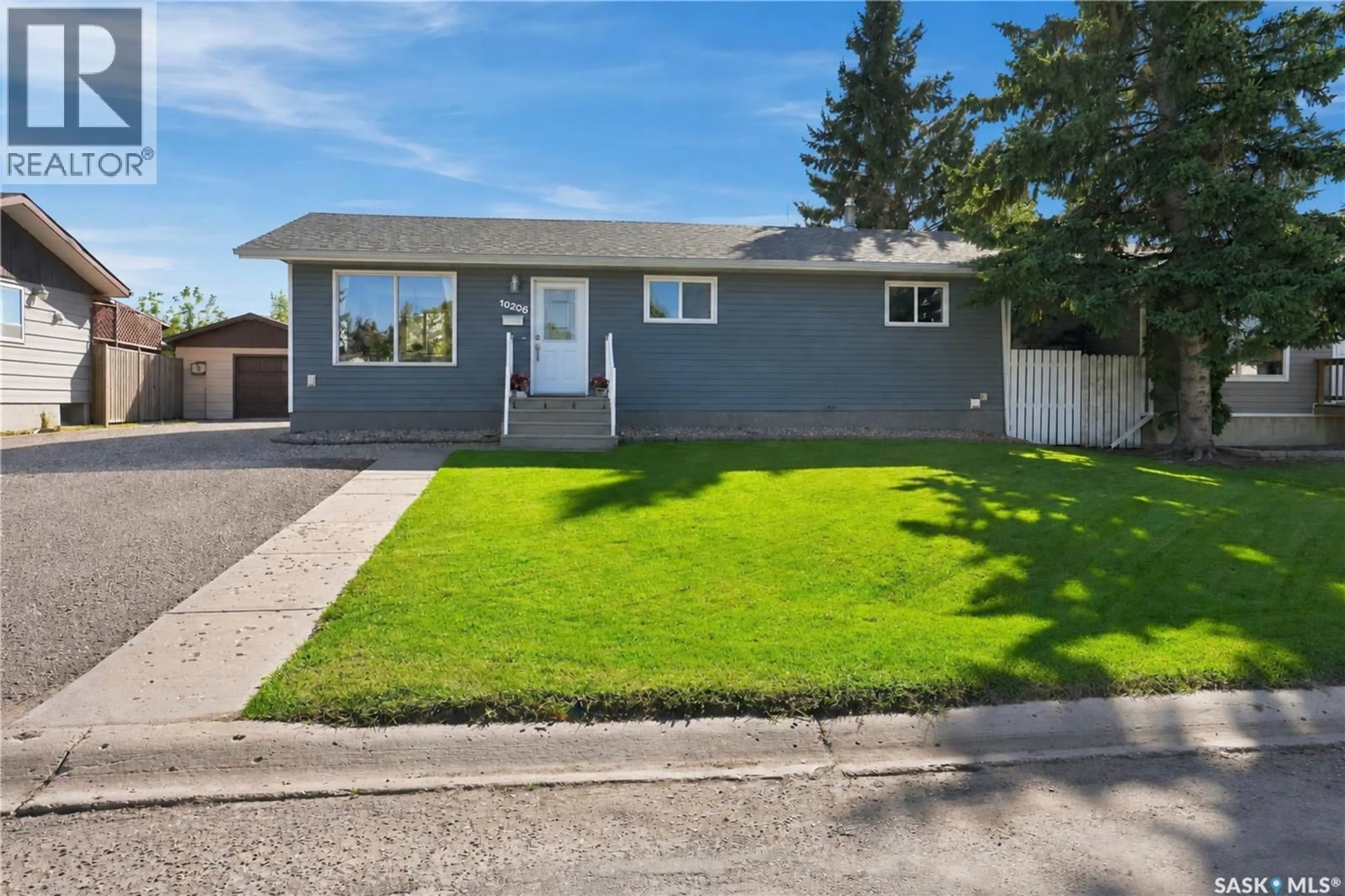 Home with vinyl exterior material, street for 10206 ROSS CRESCENT, North Battleford Saskatchewan S9A3R6