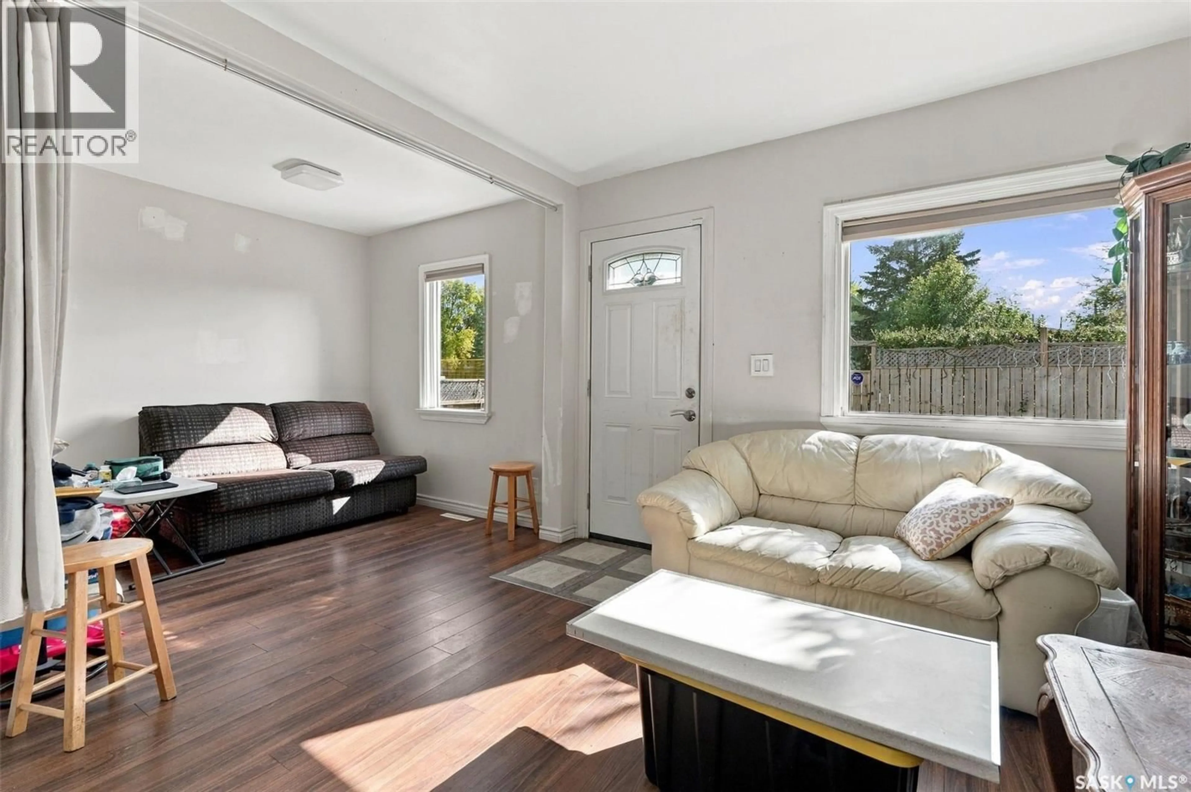 Living room with furniture, wood/laminate floor for 2210 20TH STREET, Saskatoon Saskatchewan S7M1B1