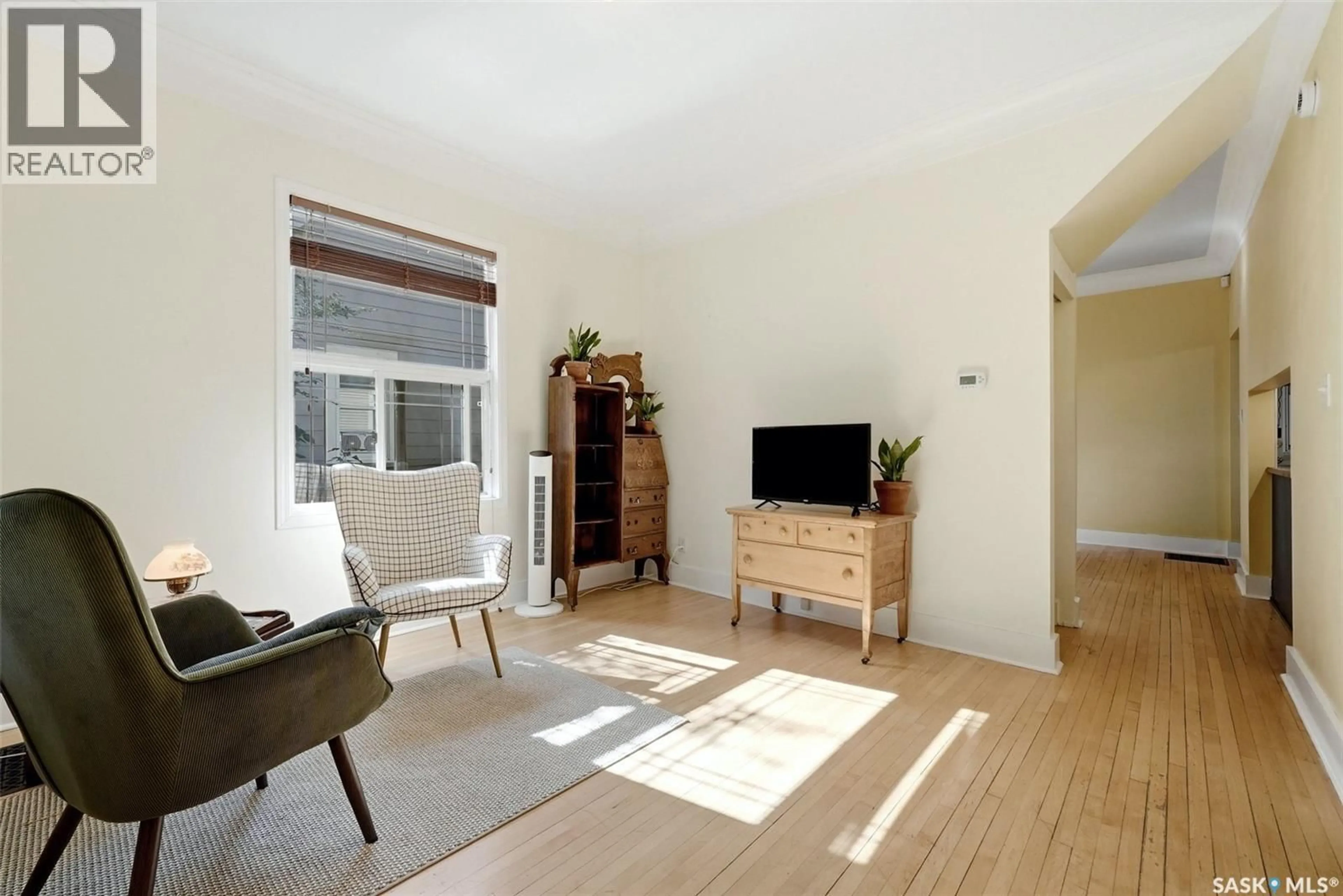 Living room with furniture, wood/laminate floor for 2112 WALLACE STREET, Regina Saskatchewan S4N4A5