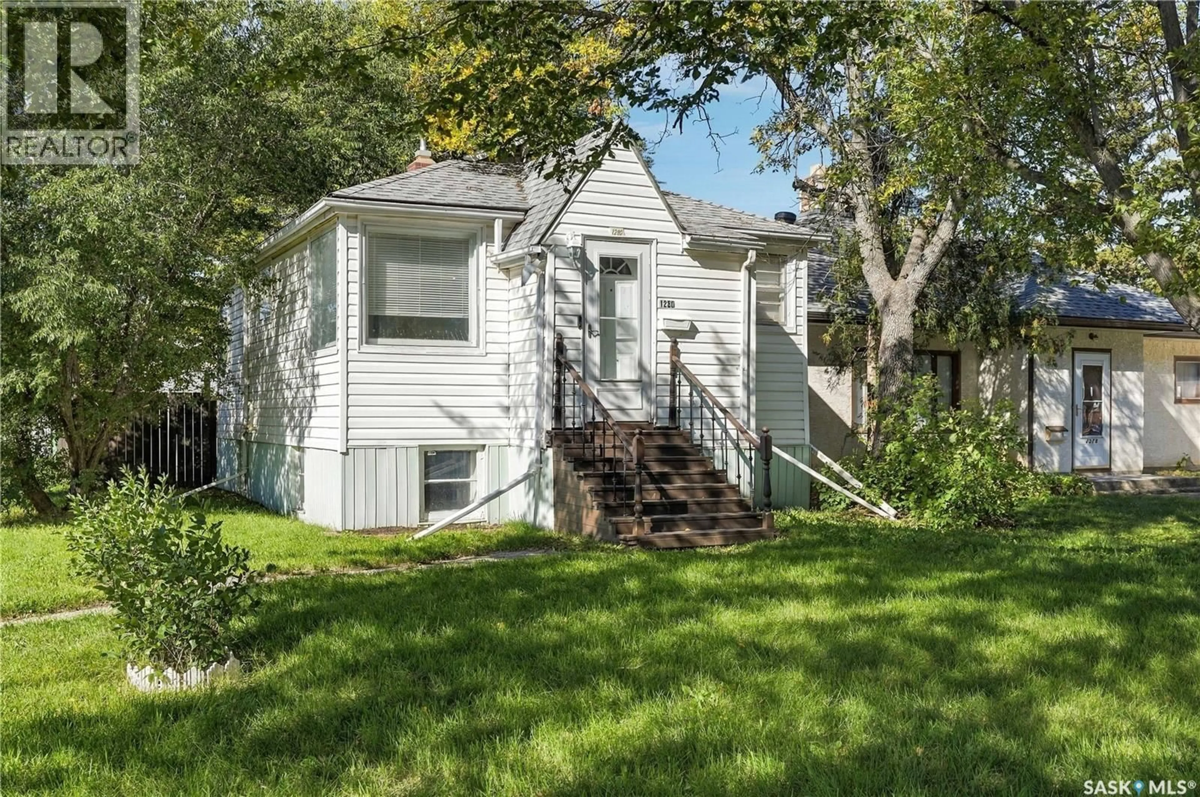 Home with vinyl exterior material, street for 1280 KING STREET, Regina Saskatchewan S4T4E9