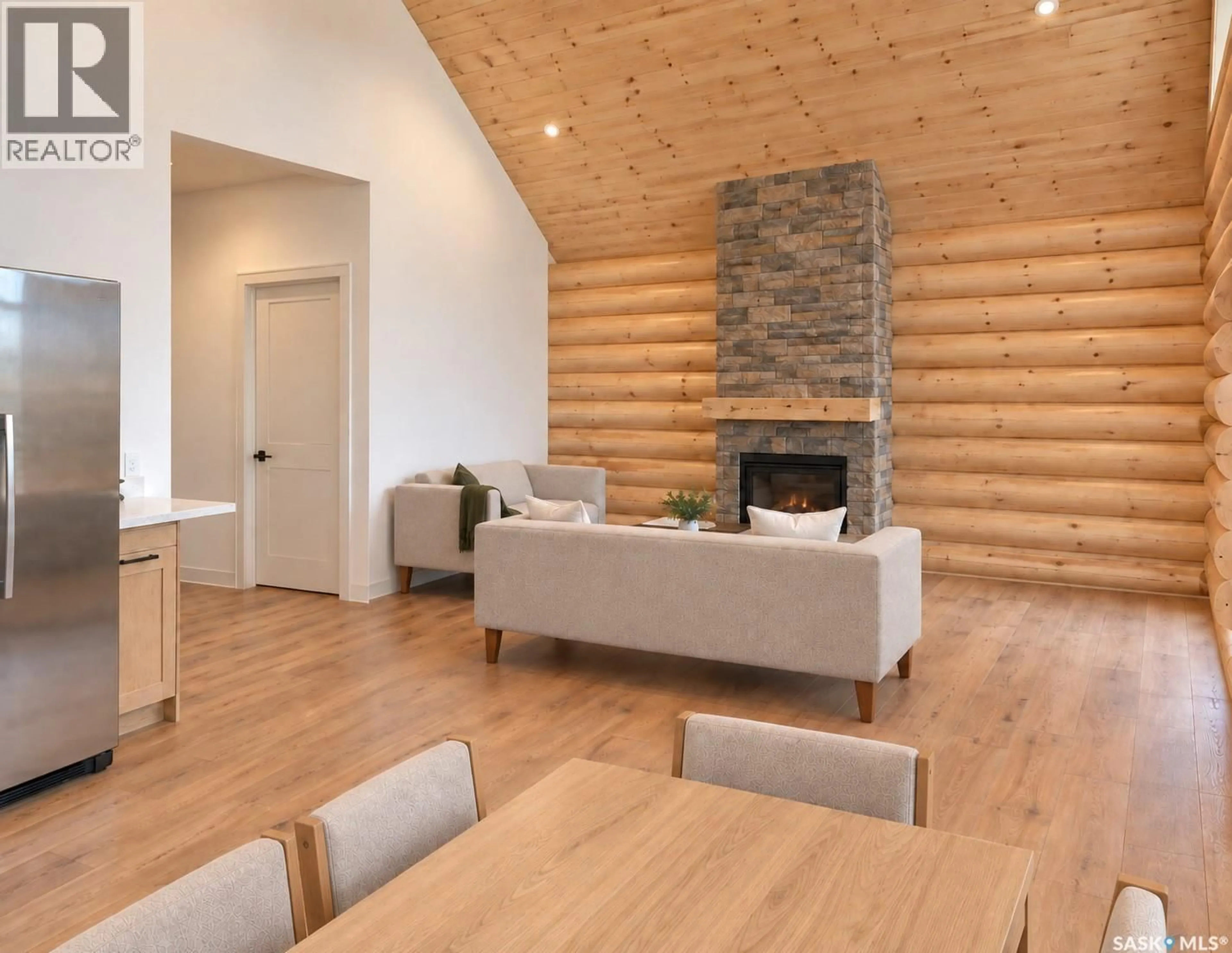 Living room with furniture, wood/laminate floor for 48 BRYDEN ROAD, Dundurn Rm No. 314 Saskatchewan S0G2E0