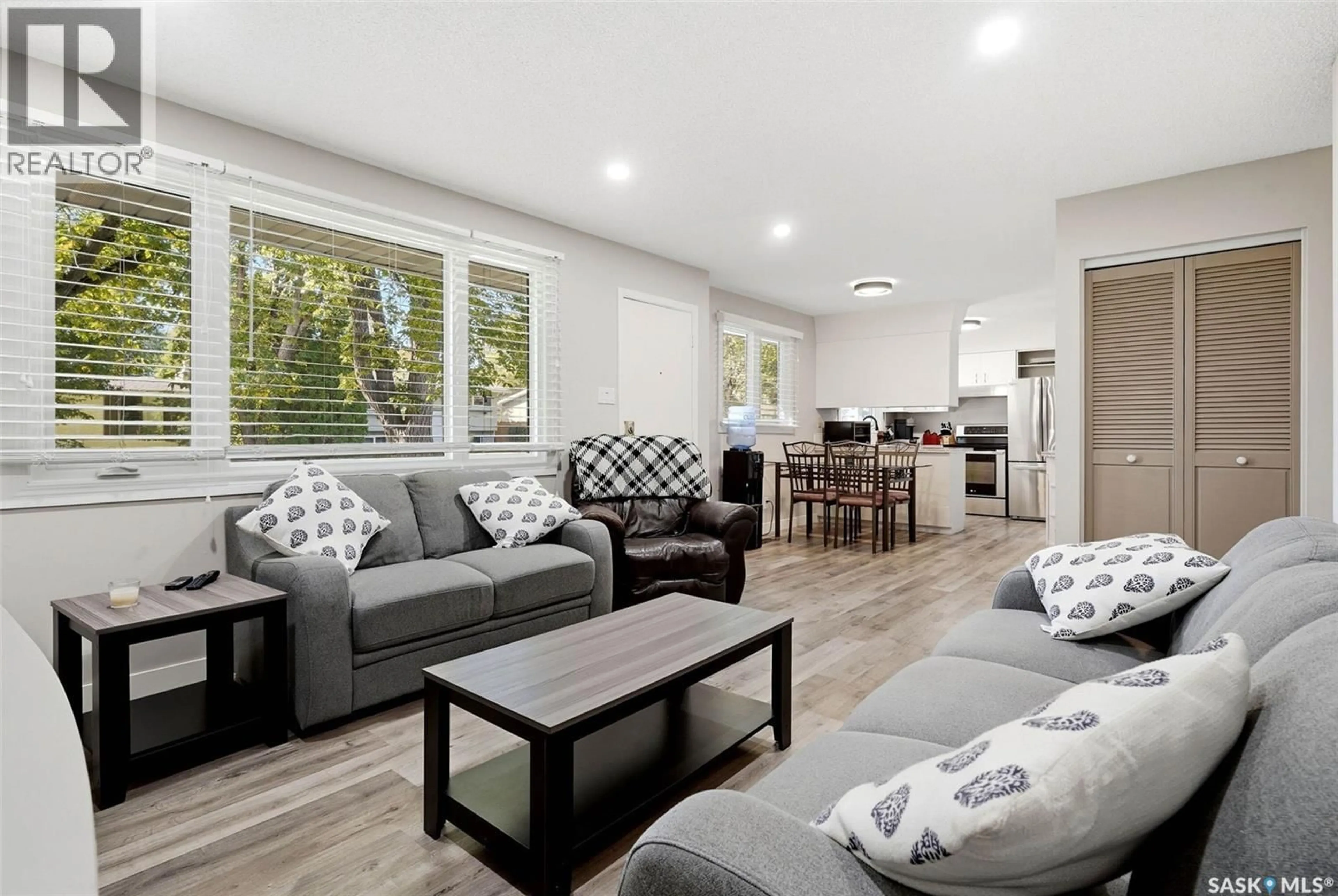 Living room with furniture, wood/laminate floor for 16 SANDISON CRESCENT, Regina Saskatchewan S4R6R9