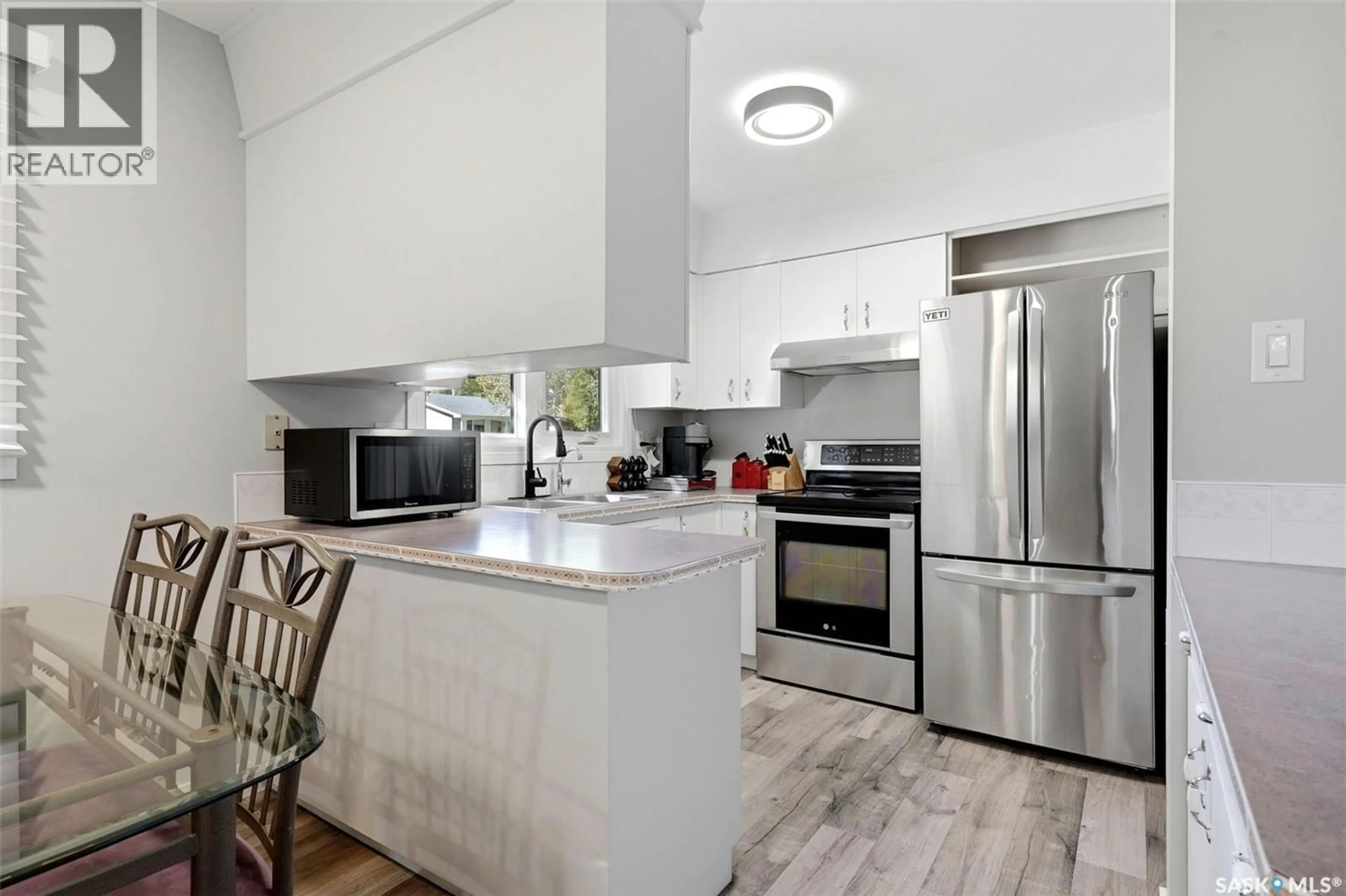 Open concept kitchen, ceramic/tile floor for 16 SANDISON CRESCENT, Regina Saskatchewan S4R6R9