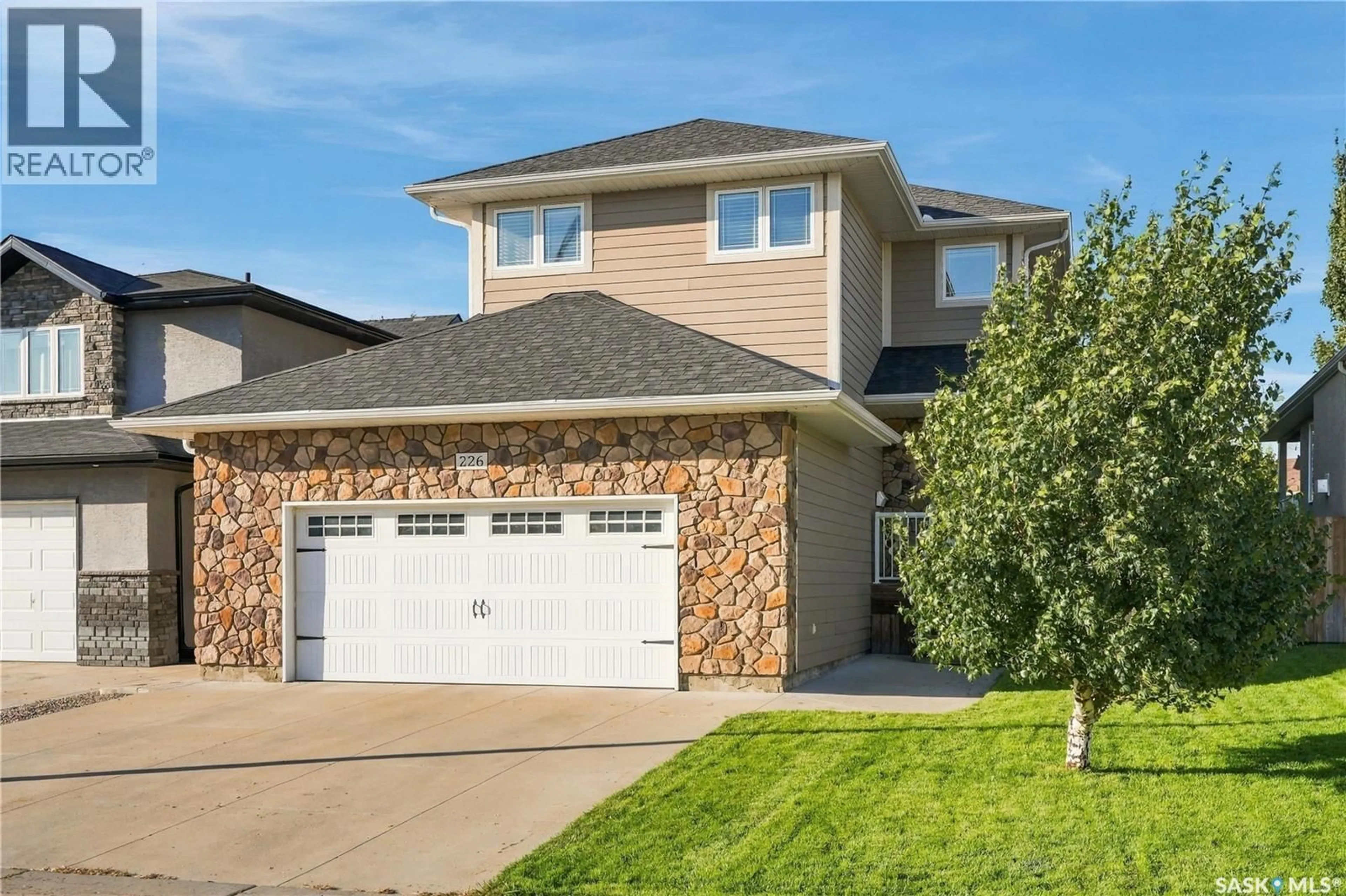 Home with vinyl exterior material, street for 226 ATTON COURT, Saskatoon Saskatchewan S7W0K8