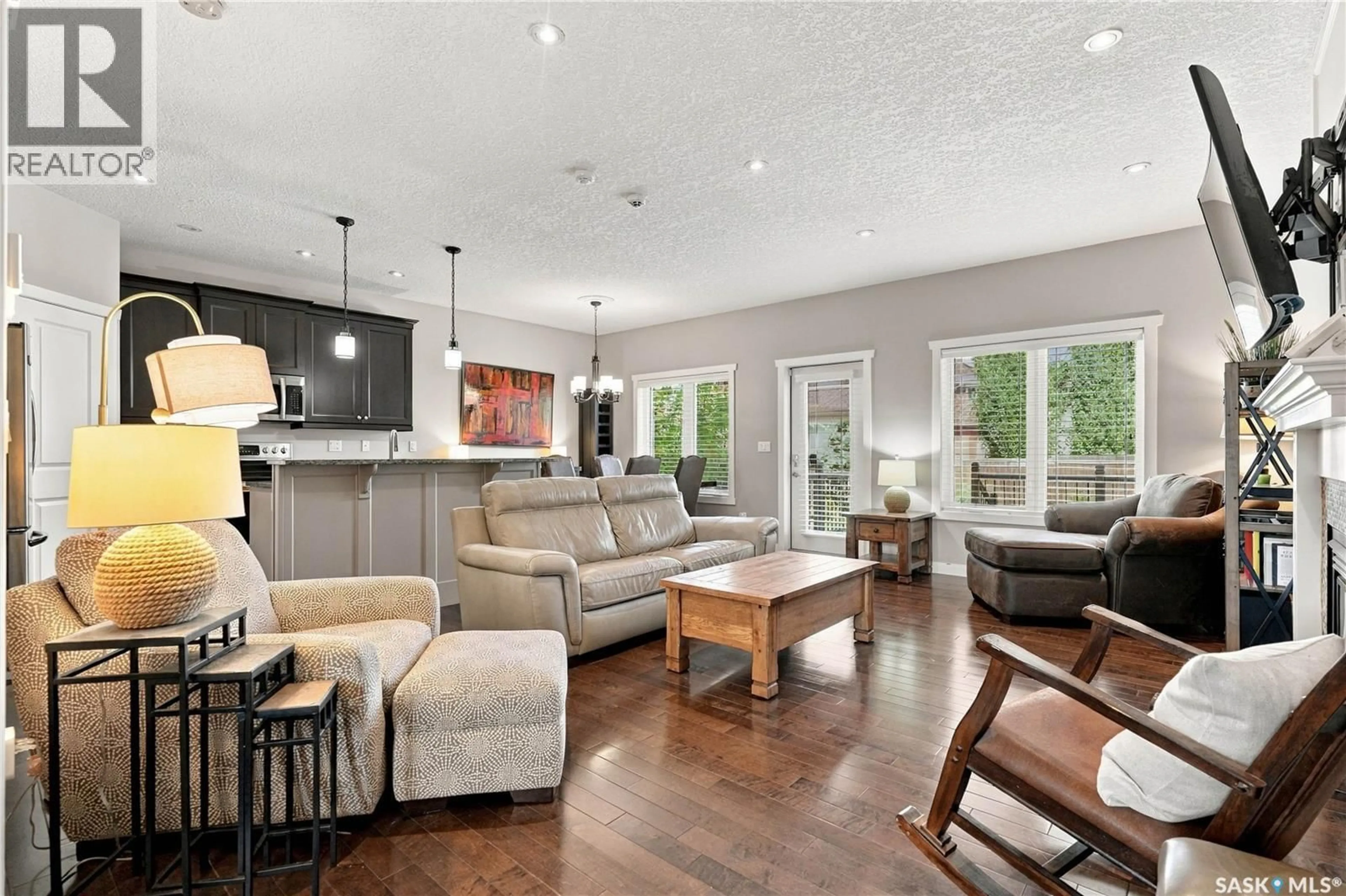 Living room with furniture, wood/laminate floor for 226 ATTON COURT, Saskatoon Saskatchewan S7W0K8