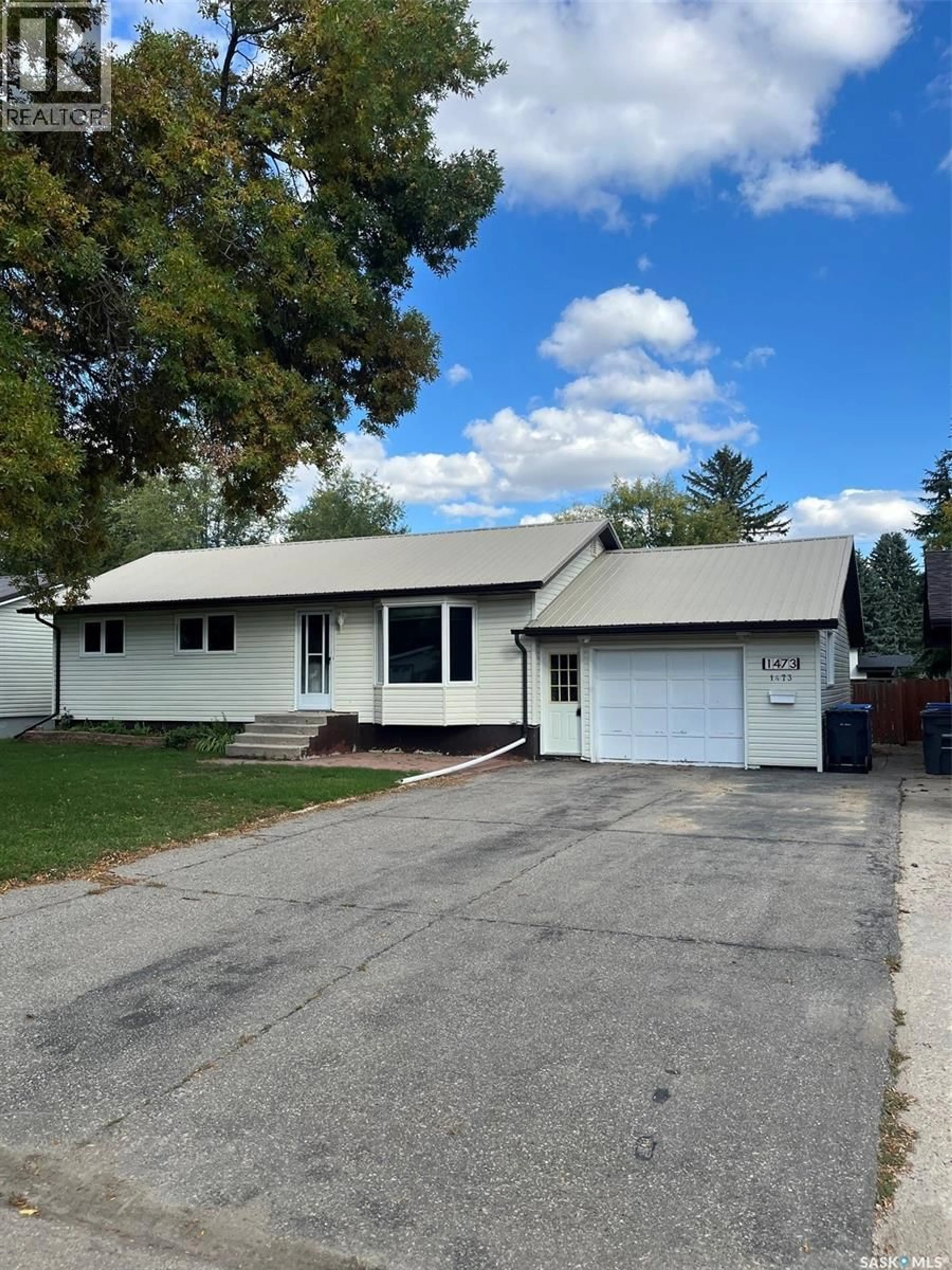 Home with vinyl exterior material, street for 1473 NICHOLSON ROAD, Estevan Saskatchewan S4A2G8