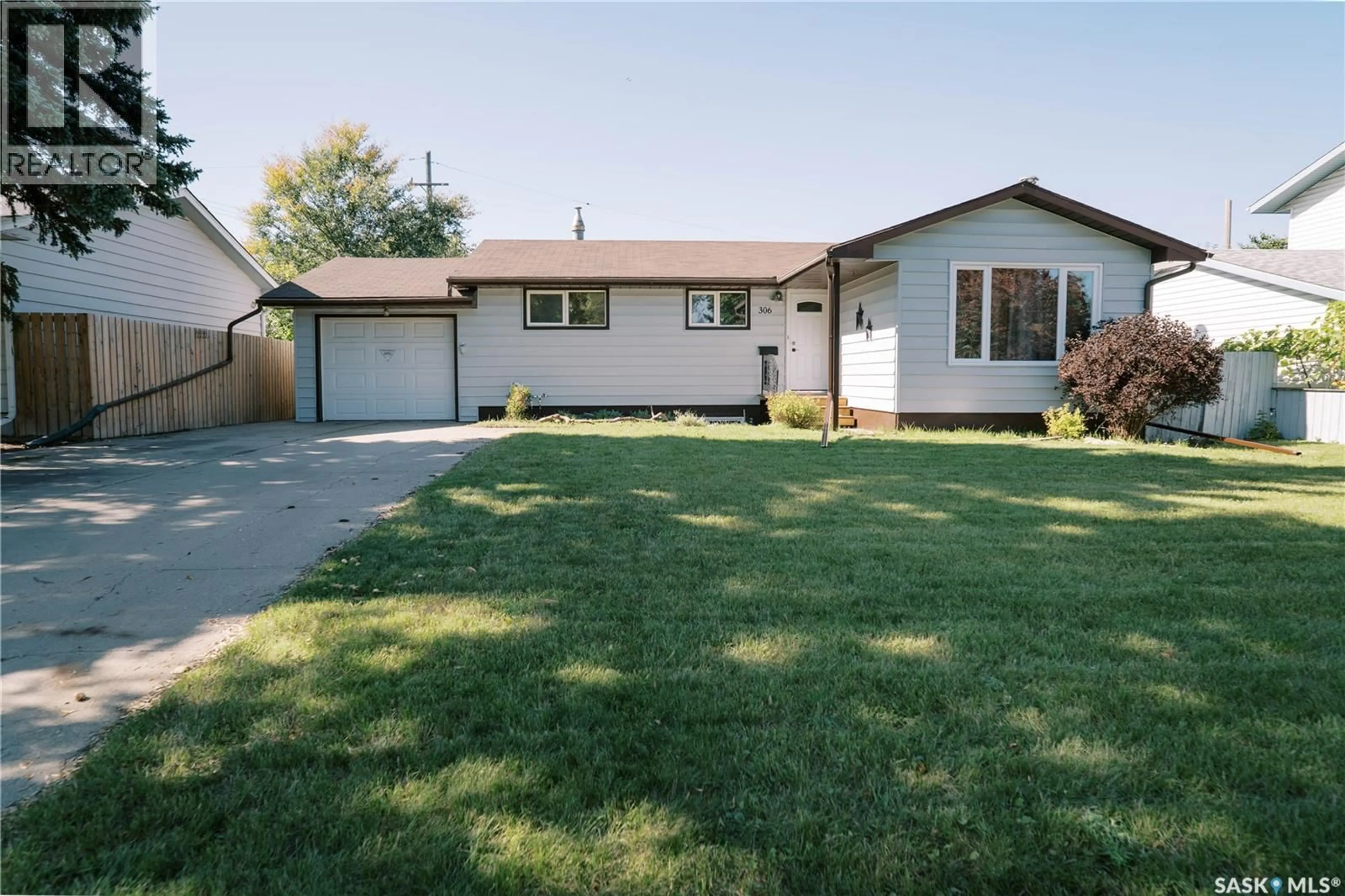 Home with vinyl exterior material, street for 306 EGBERT AVENUE, Saskatoon Saskatchewan S7N1X1