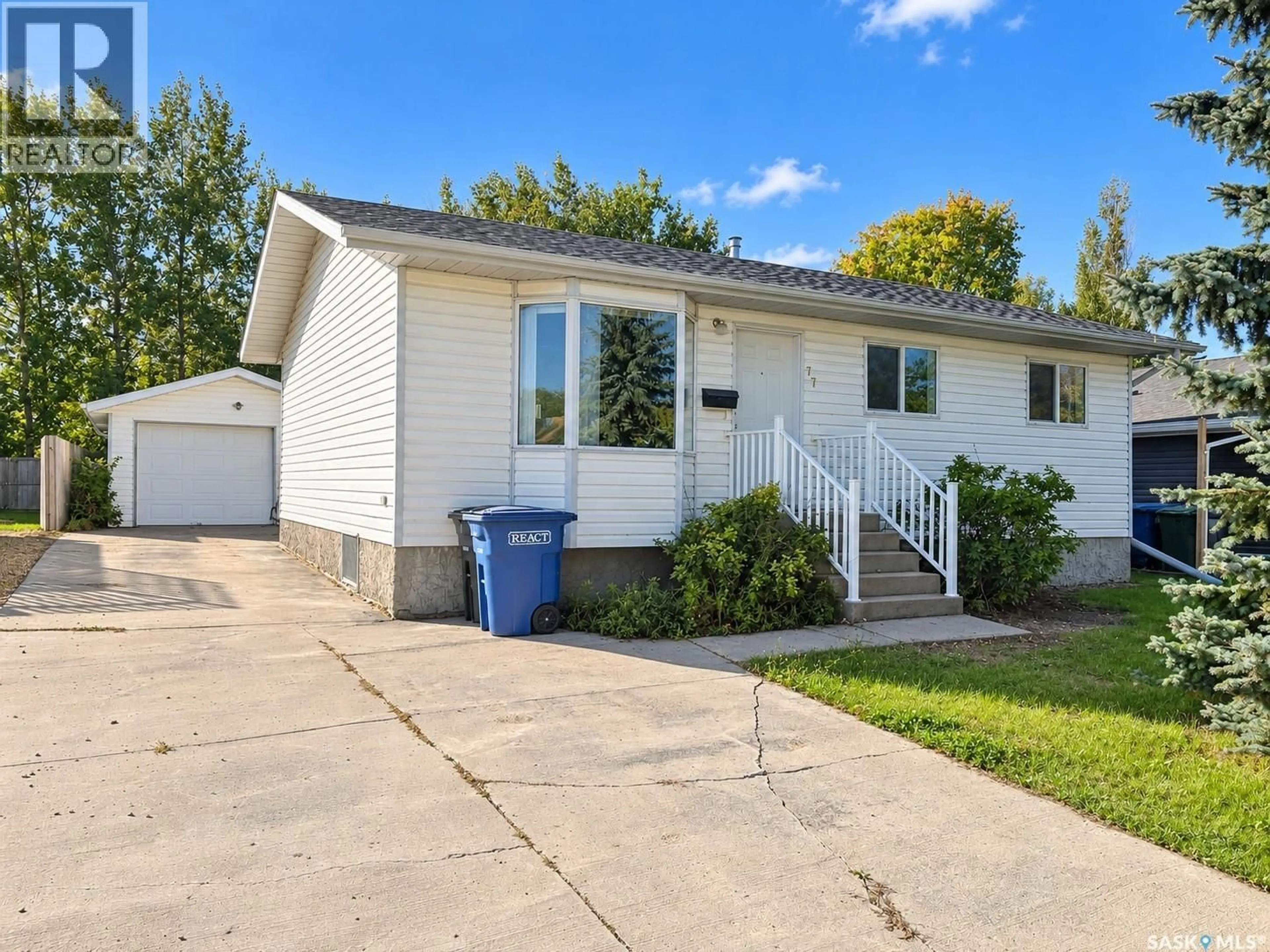 Home with vinyl exterior material, street for 77 3RD STREET, Humboldt Saskatchewan S0K2A0