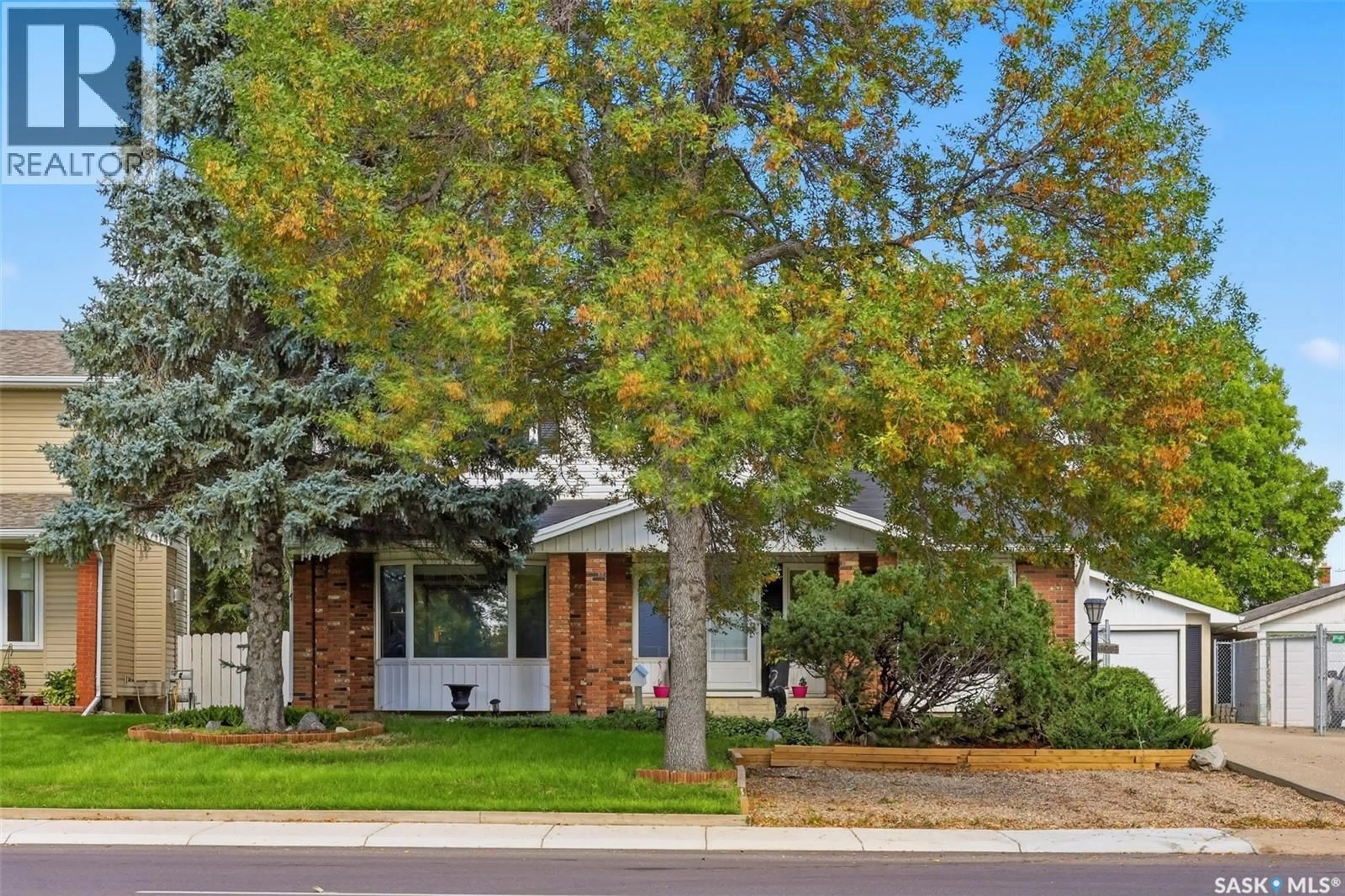 Home with brick exterior material, street for 6218 SHERWOOD DRIVE, Regina Saskatchewan S4T7G2