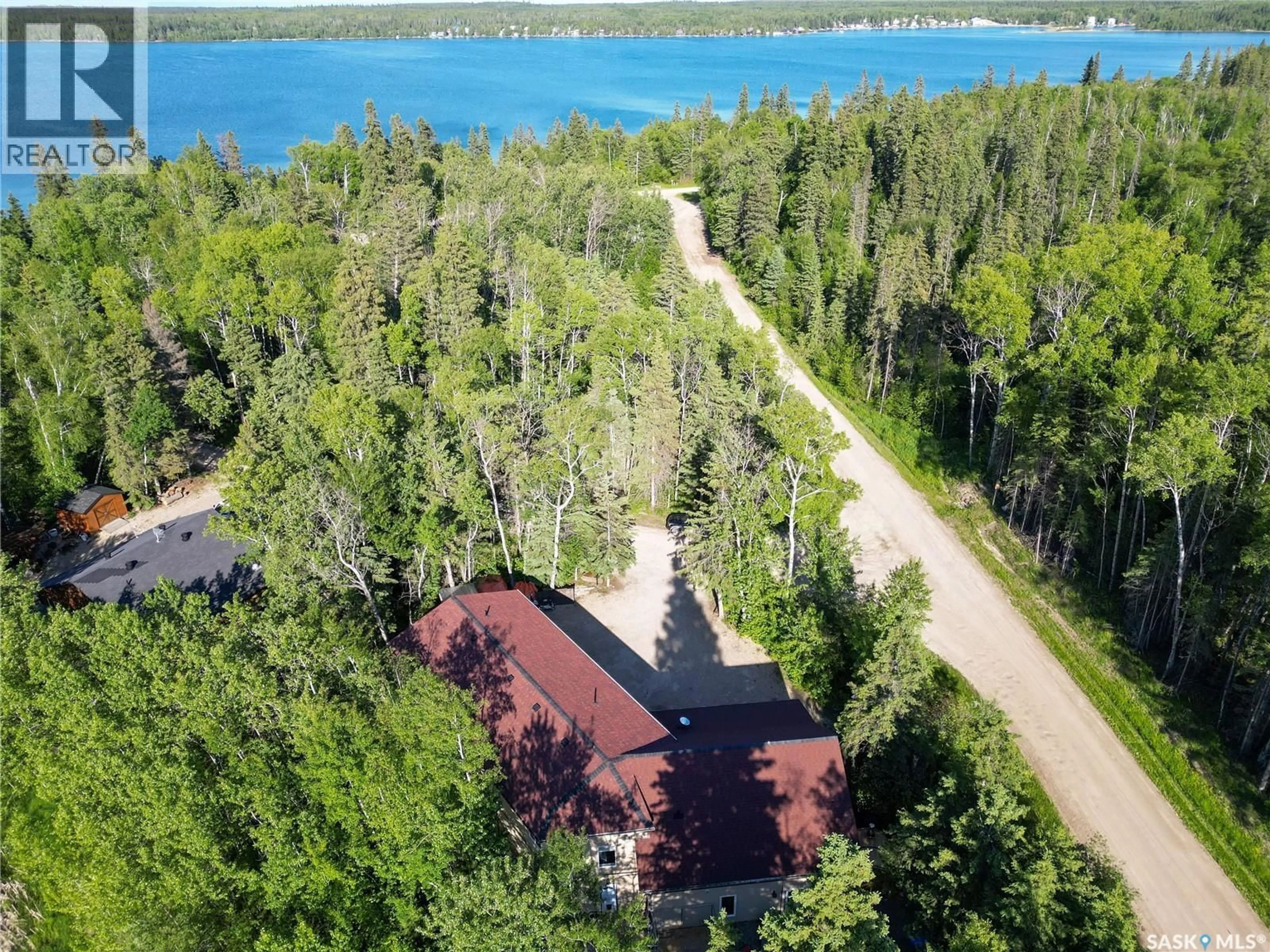 A pic from outside/outdoor area/front of a property/back of a property/a pic from drone, water/lake/river/ocean view for 102 MOORE DRIVE, Lakeland Rm No. 521 Saskatchewan S0J0N0