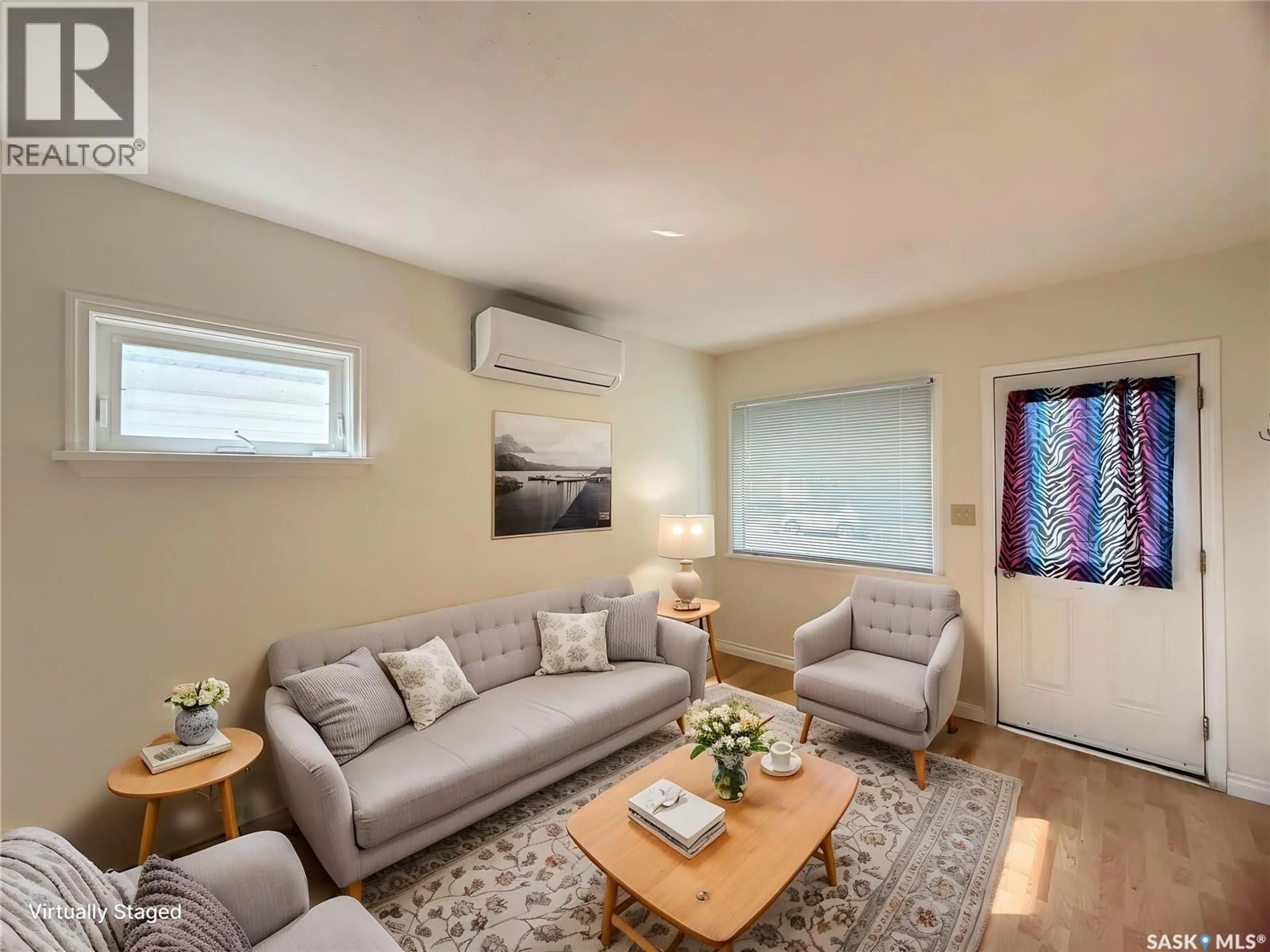 Living room with furniture, wood/laminate floor for 1215 BRODER STREET, Regina Saskatchewan S4N3R3